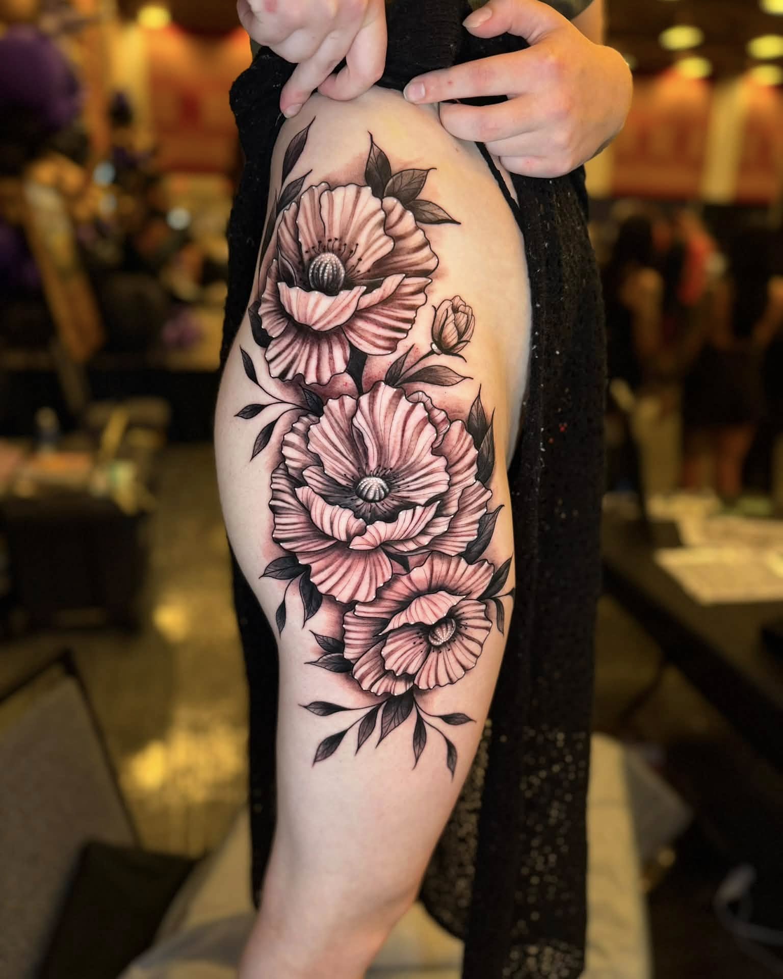 Flowers black and grey tattoo on the thigh by Chad Meado