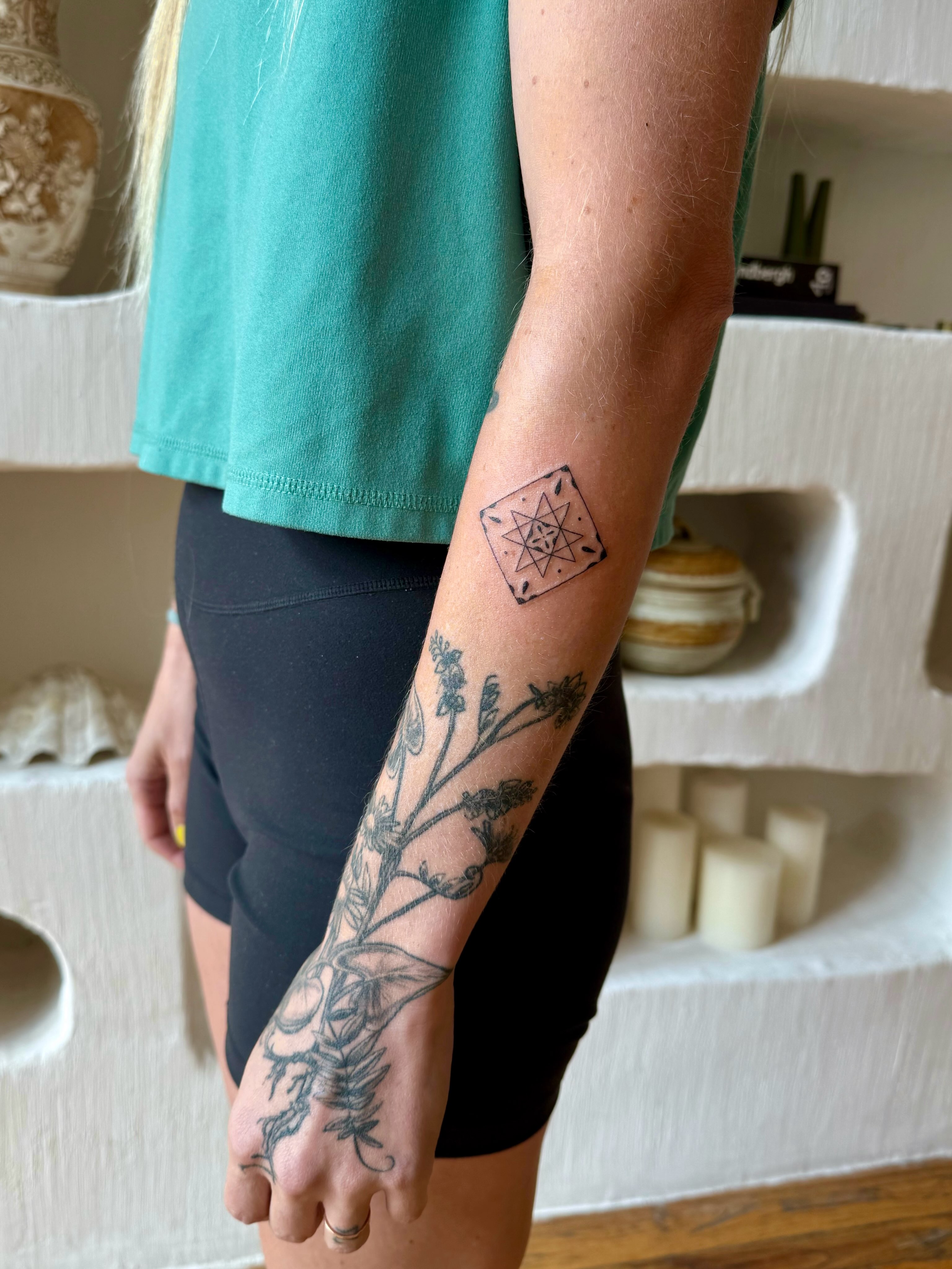 Botanical geometric tattoo on the forearm by Shilo Gold 🍒