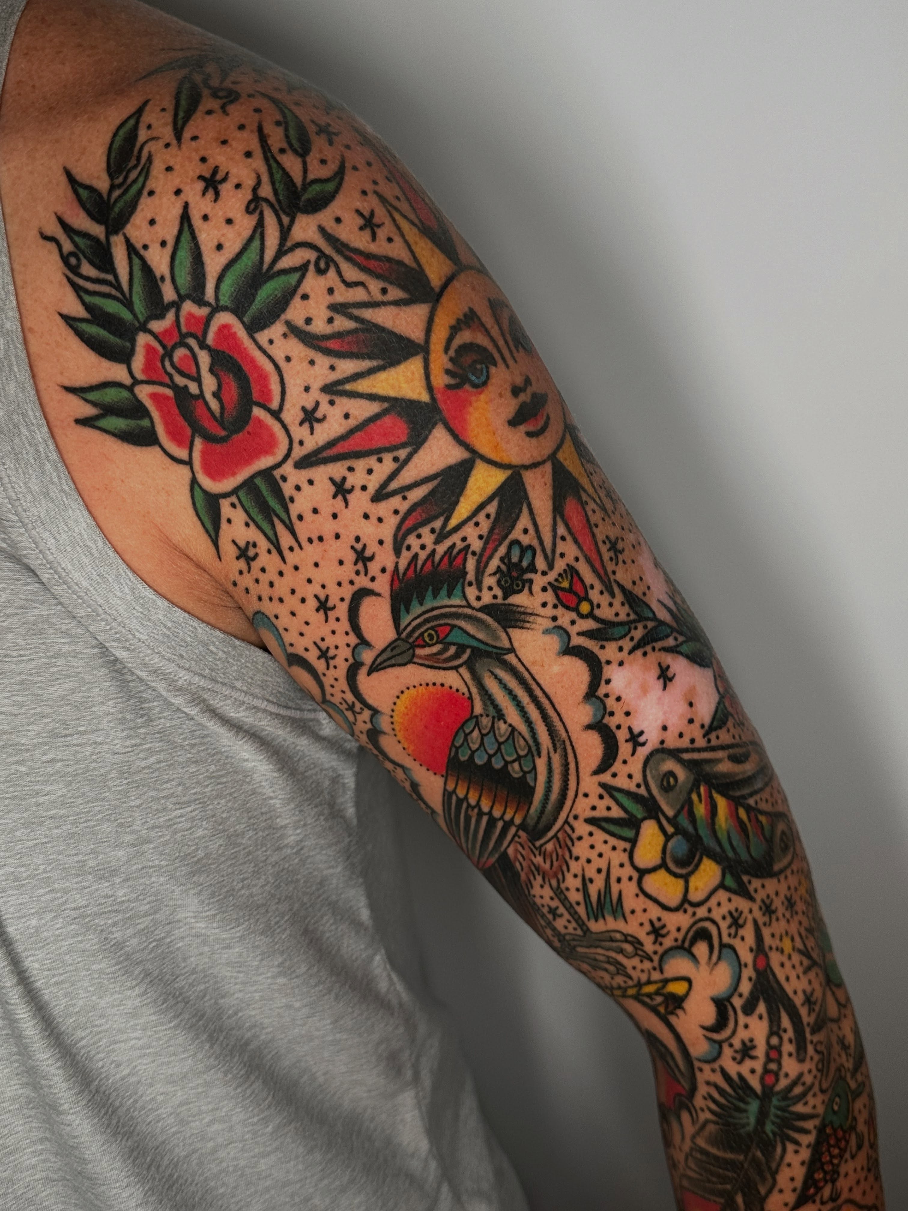 Bird and sun American traditional tattoo on the forearm by Spencer Crawford, Speedway, Indiana