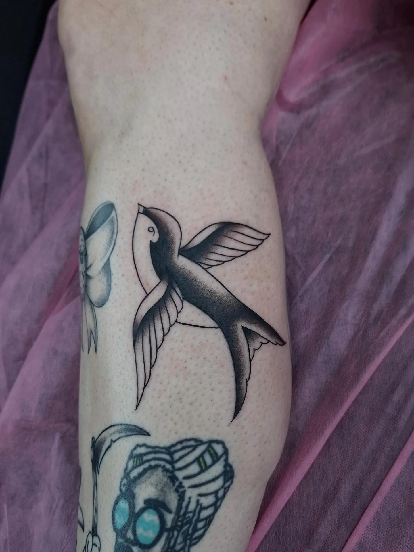 Swallow and flower dotwork tattoo on the forearm by ꧁༺𝔅𝔦𝔤 ℭ𝔥𝔲𝔫𝔤𝔲𝔷༻꧂, San Diego, California