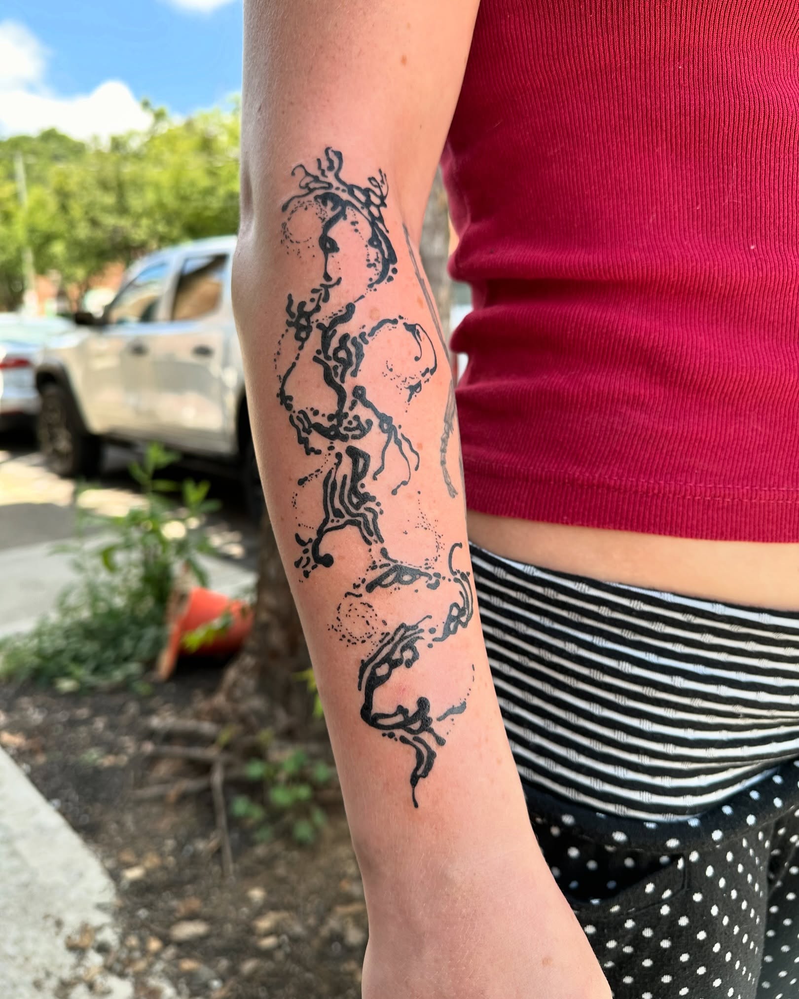 Abstract design dotwork tattoo on the forearm by reid - tattoo artist