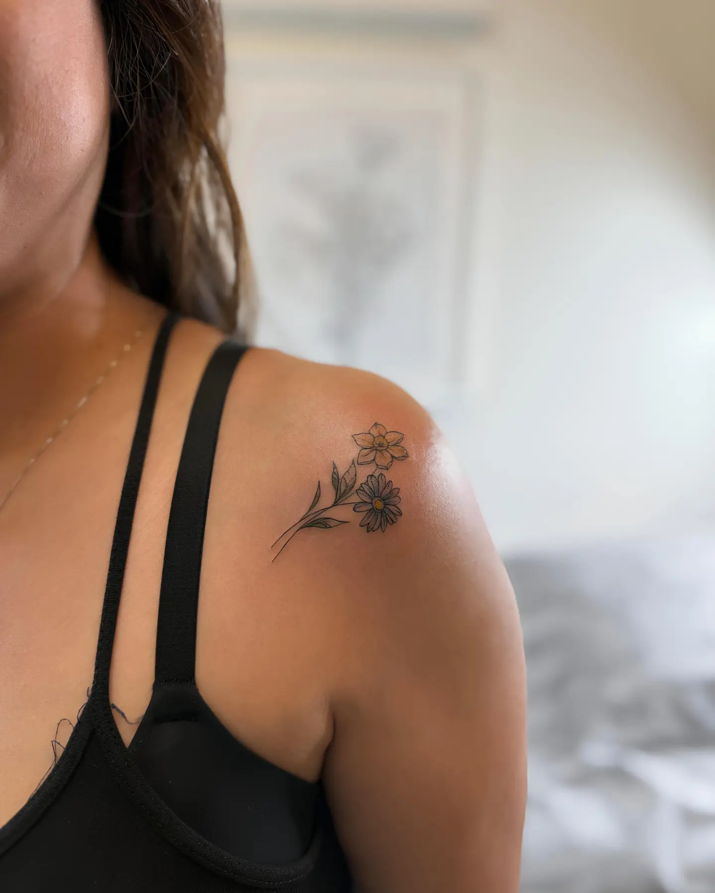 Flowers black and grey tattoo on the shoulder by Floral Fineline Tattoo