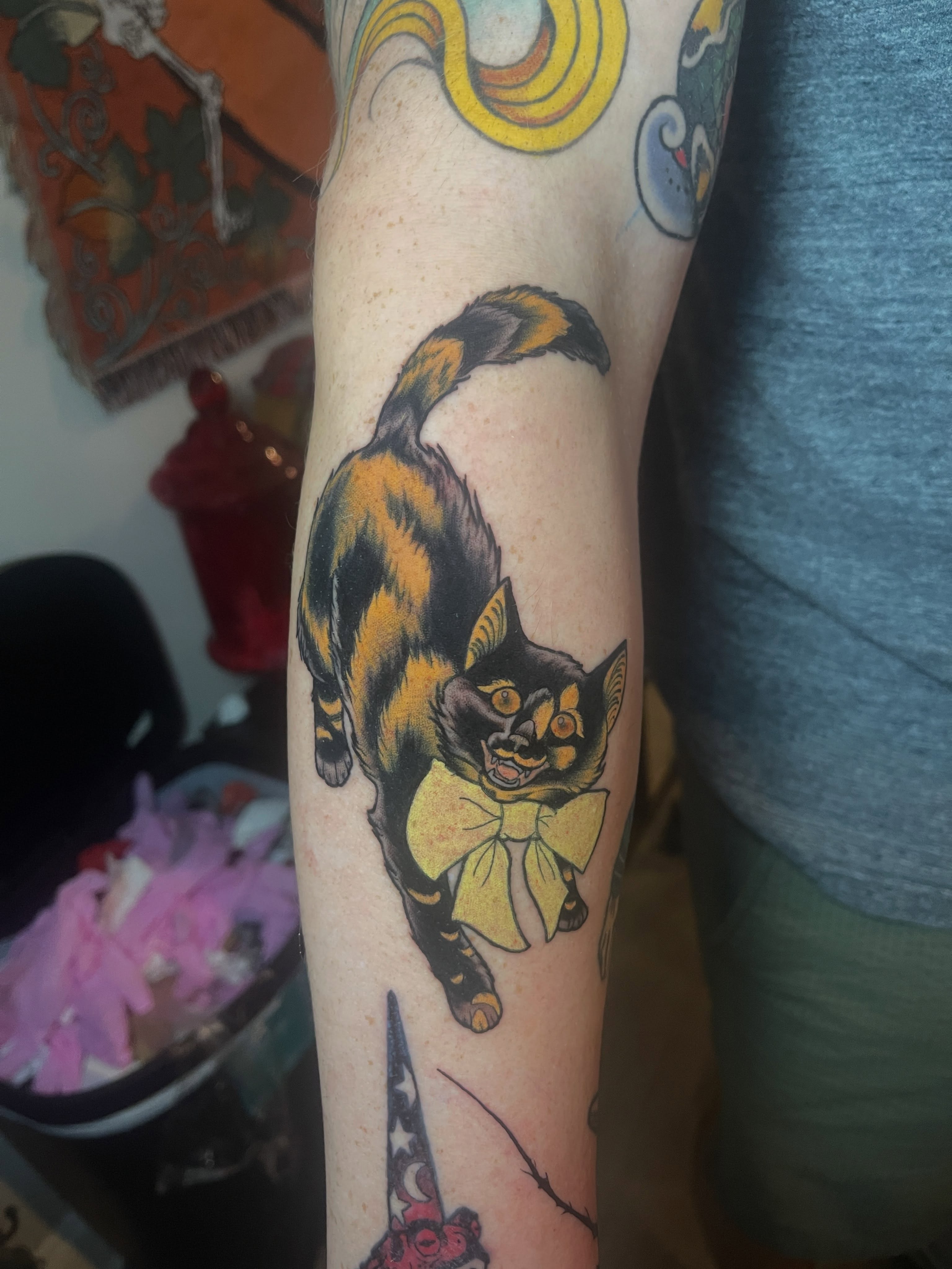 Calico cat American traditional tattoo on the forearm by Joe Moreira