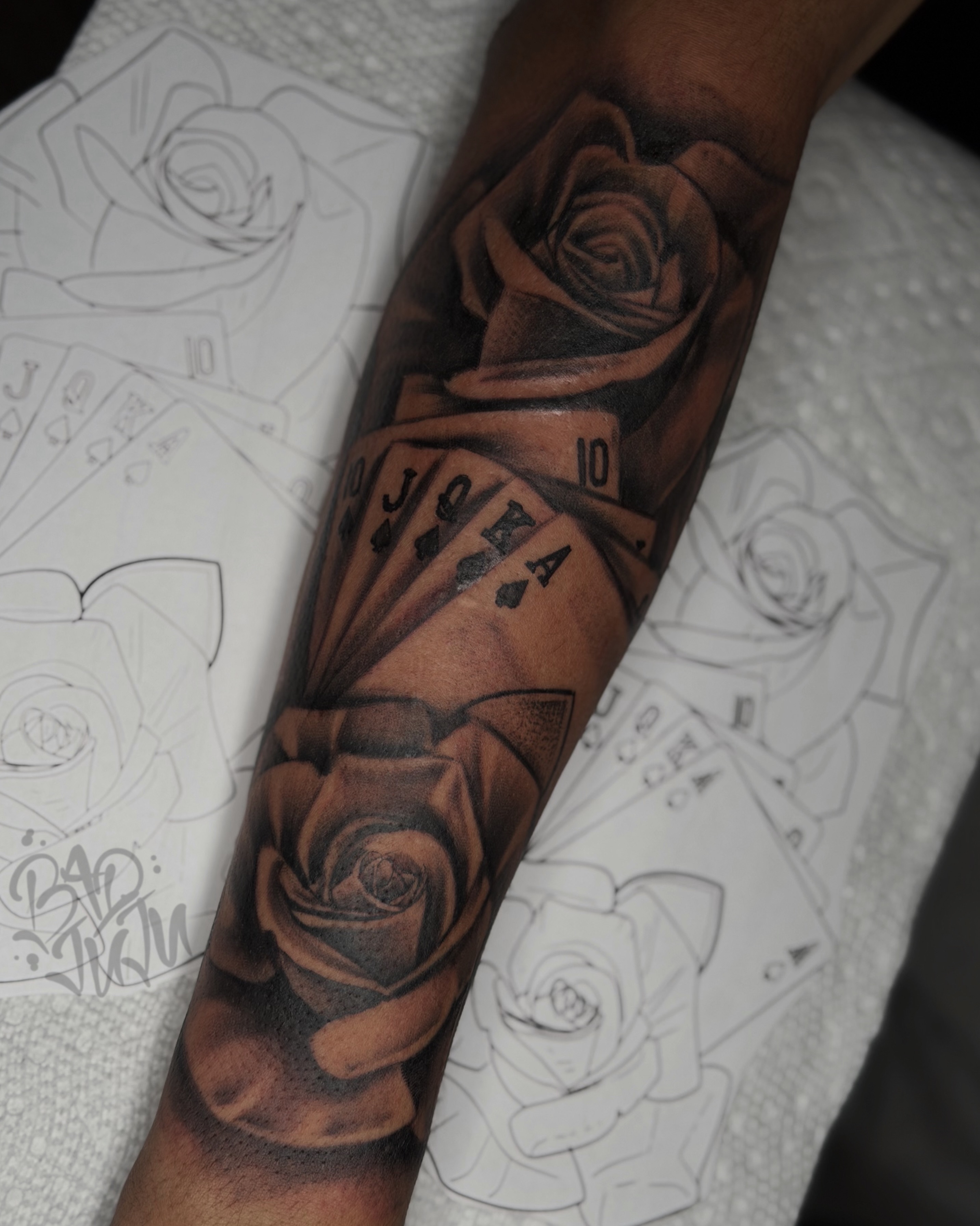 Roses and playing cards realism tattoo on the forearm by 💞Juju💕