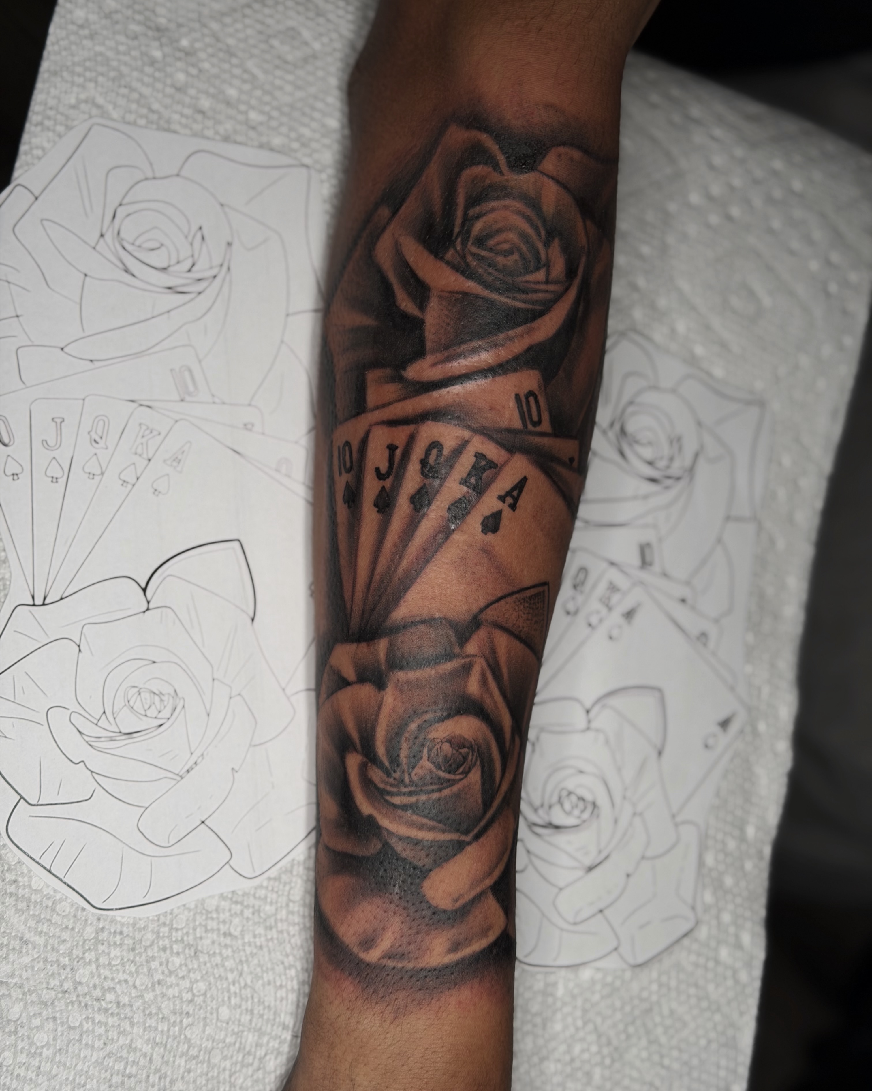Roses and playing cards realism tattoo on the forearm by 💞Juju💕