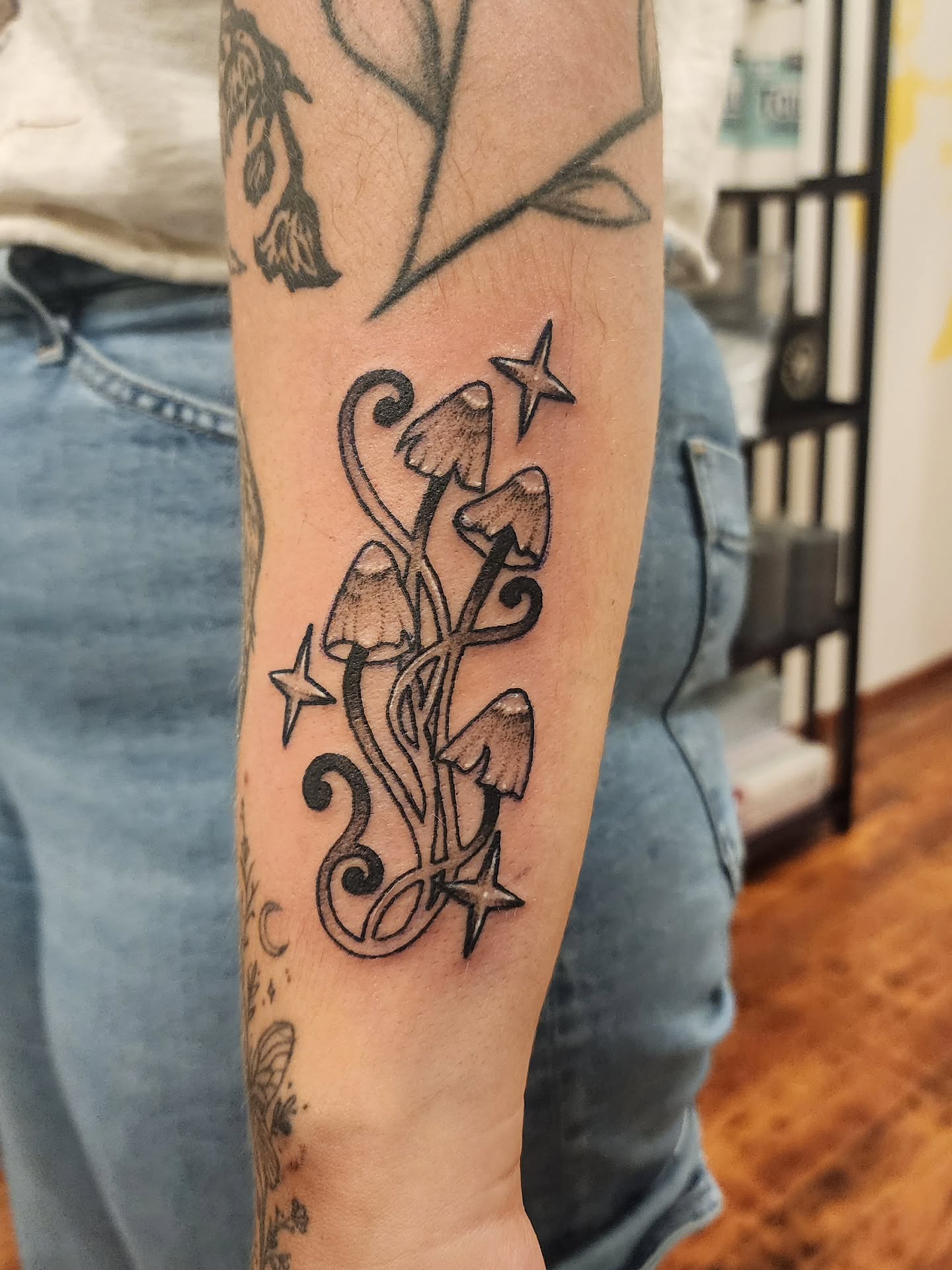 Mushroom cluster black and grey tattoo on the forearm by mikayla