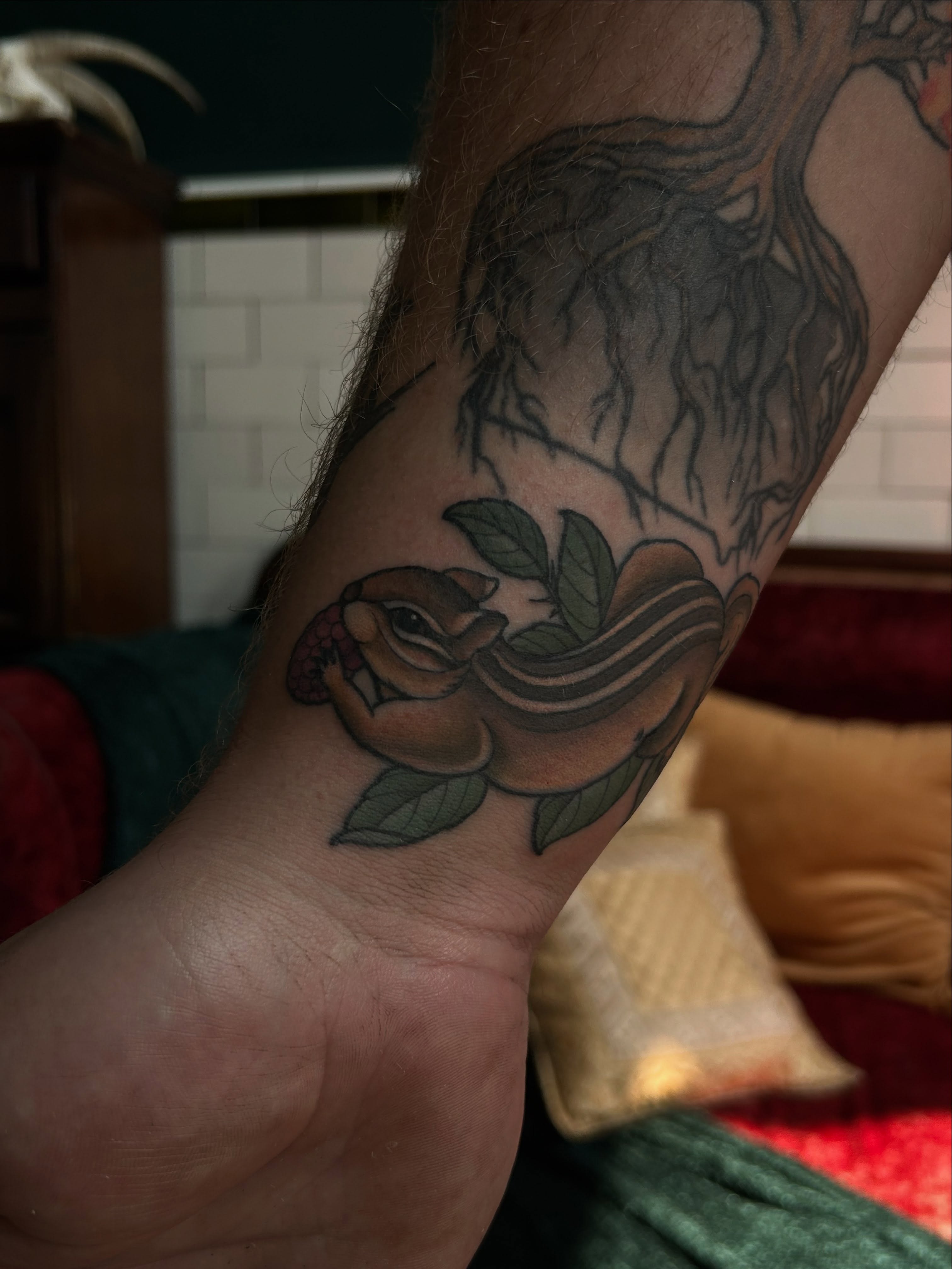 Chipmunk and leaves realism tattoo on the forearm by ꧁𝙺𝚊𝚛𝚒𝚗𝚊꧂, Grinnell, Iowa