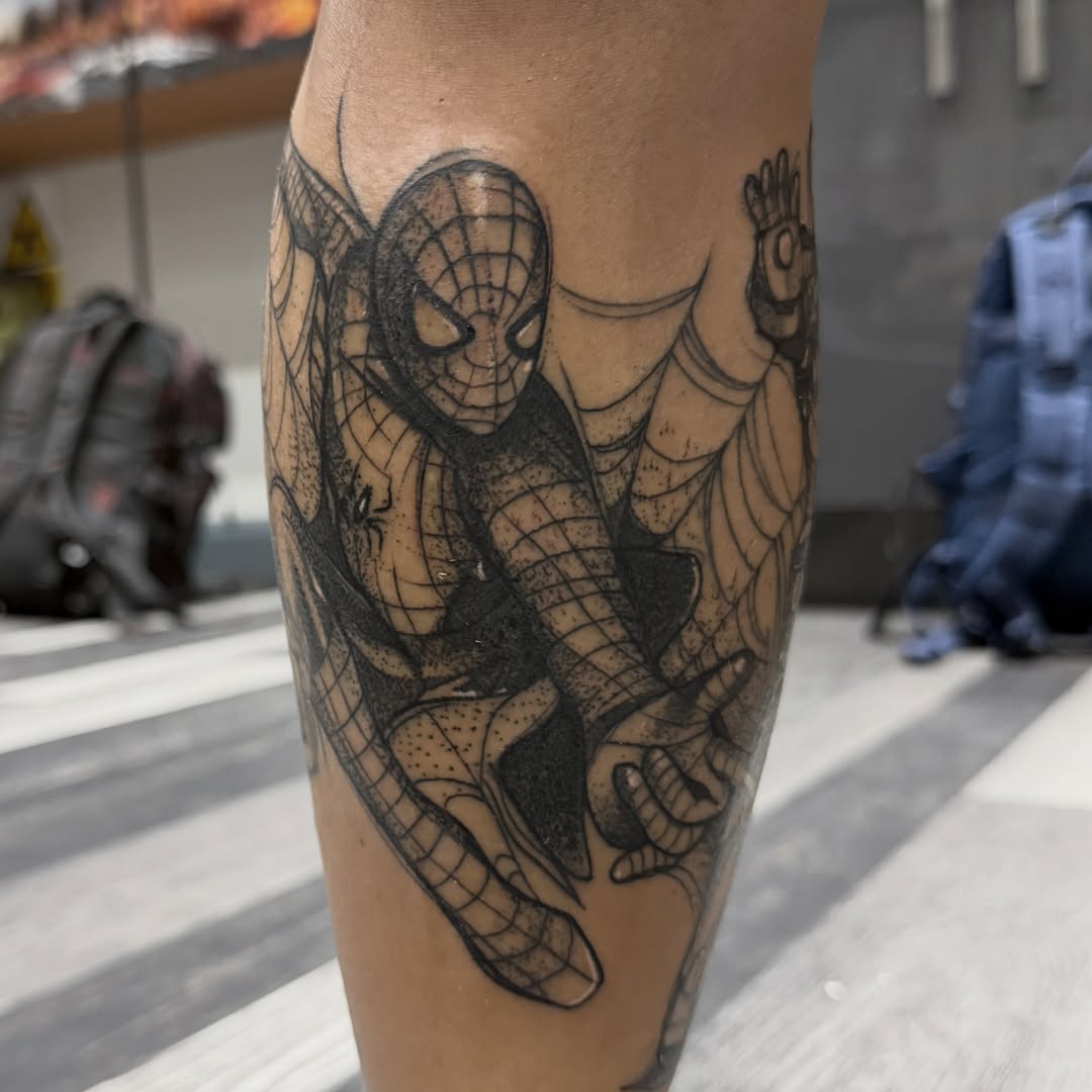 Spider-man black and grey tattoo on the forearm by Aiden Shaw