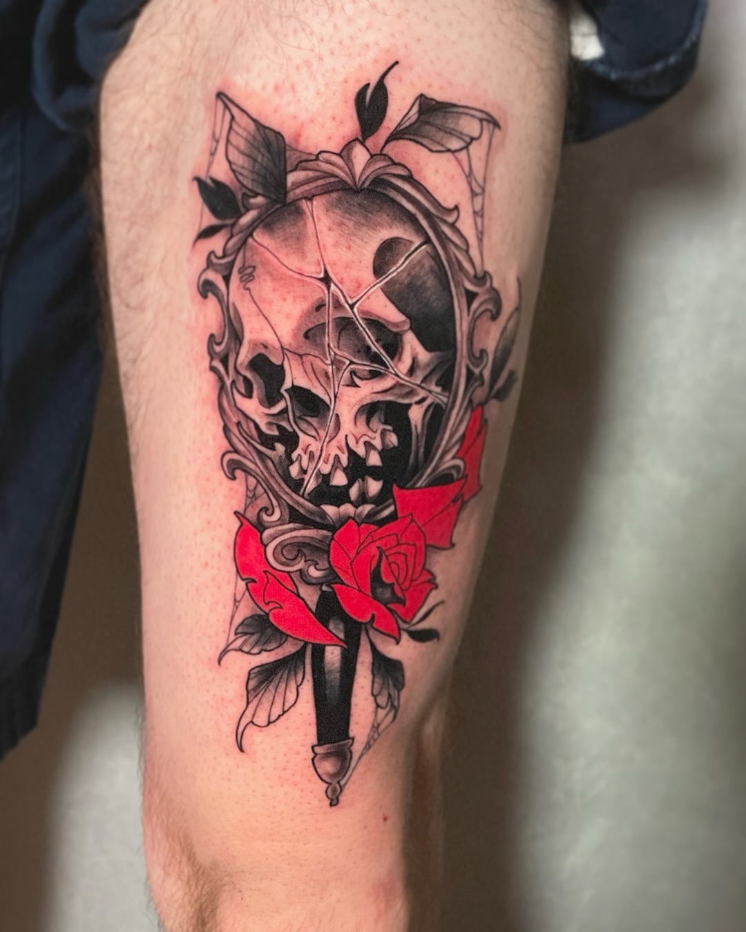 Skull and roses realism tattoo on the forearm by Riley Borne