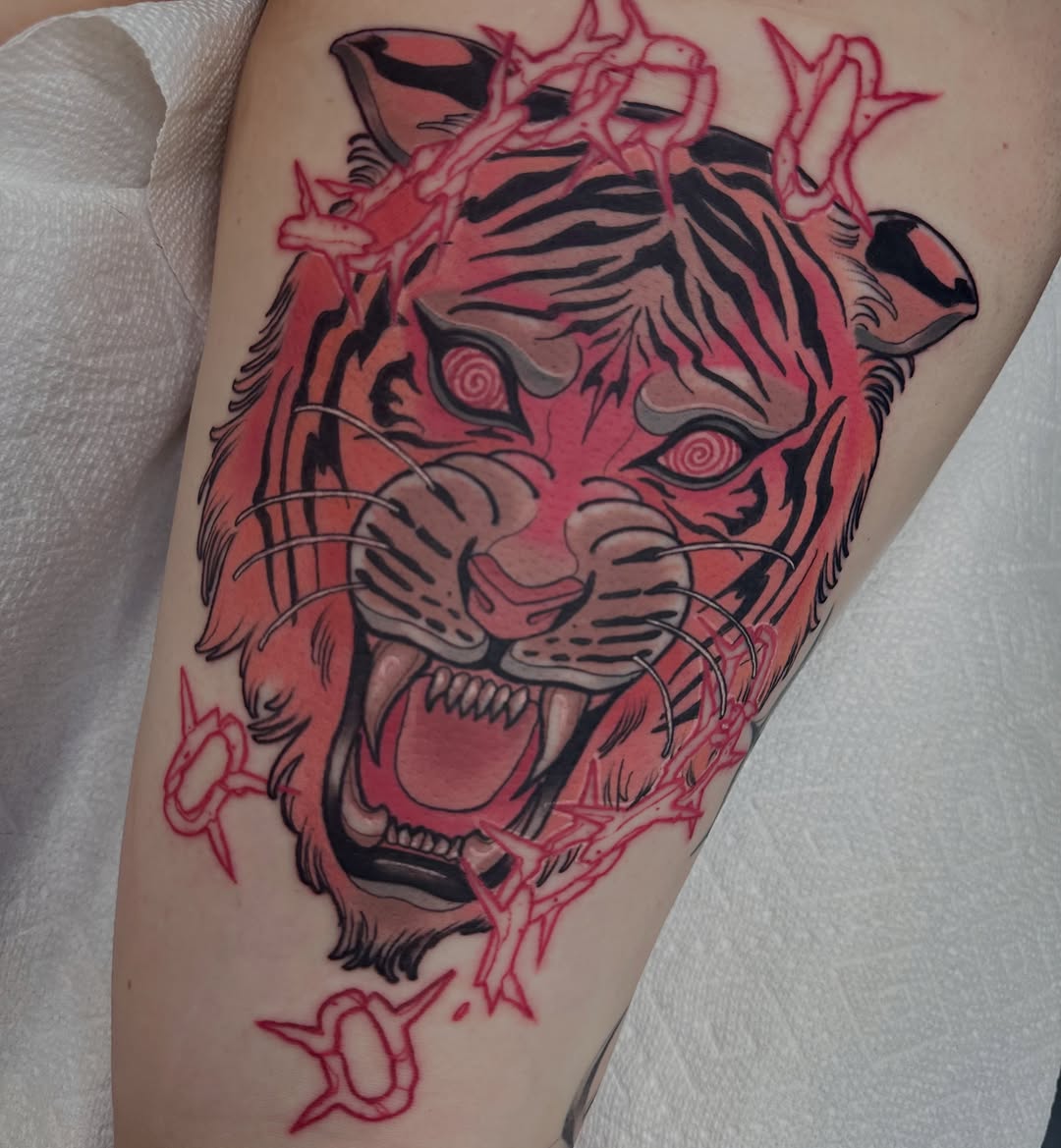 Tiger American traditional tattoo on the forearm by Jenn Golgan