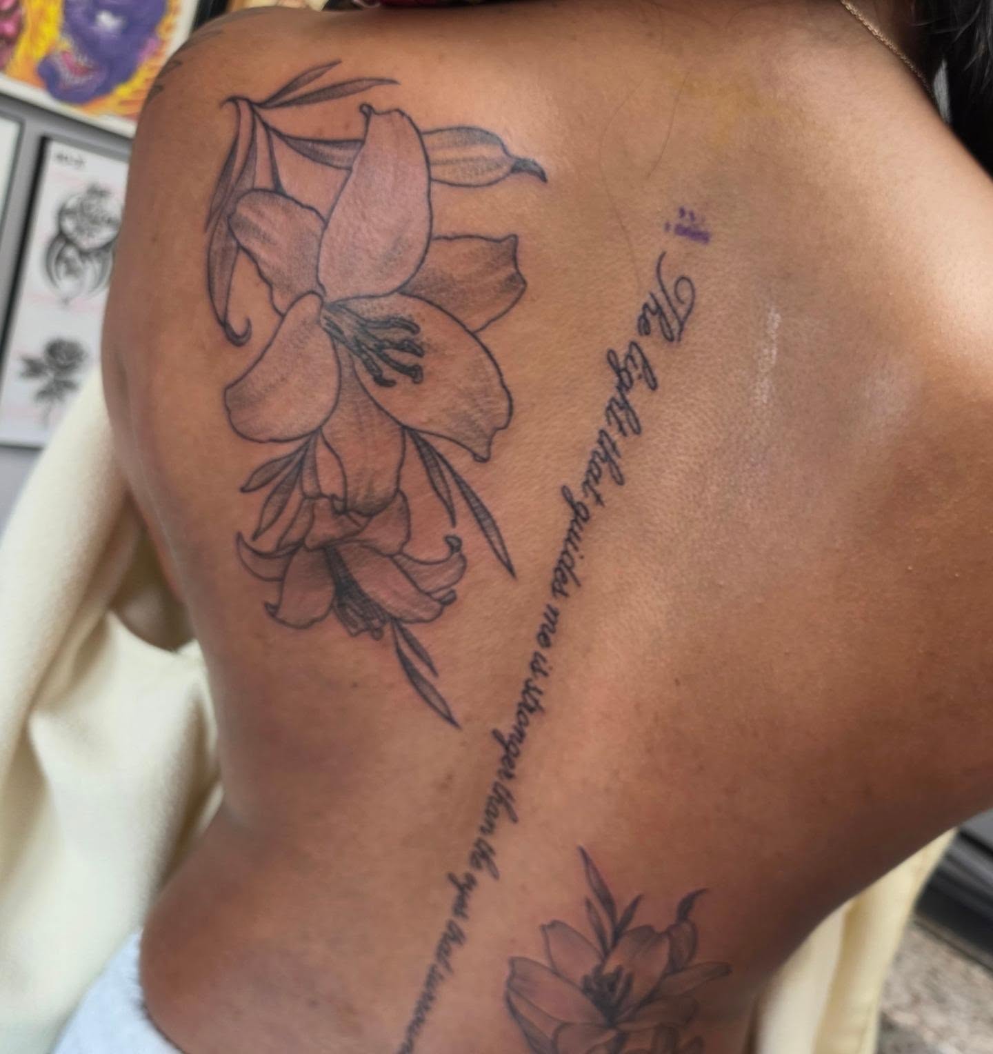 Lily flowers black and grey tattoo on the back by Colleen