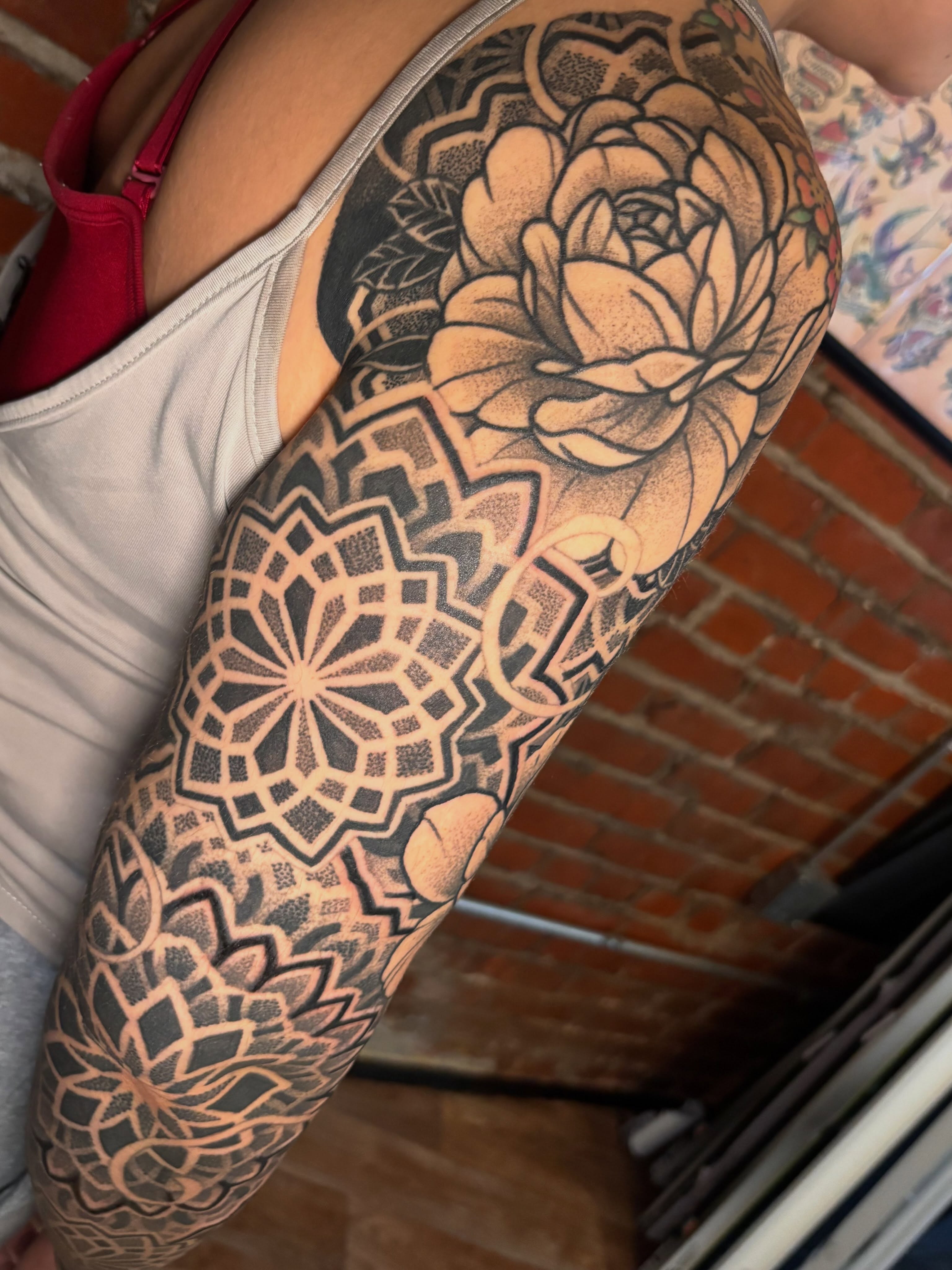 Geometric mandala dotwork tattoo on the forearm by Steven Campbell, Kansas City, Missouri