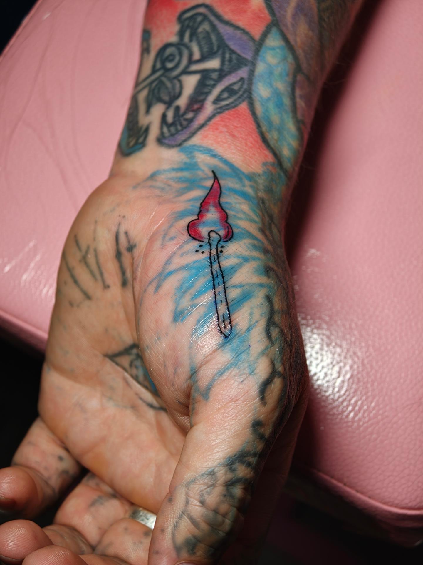 Torch American traditional tattoo on the hand by Dani Sandoval, Anaheim, California