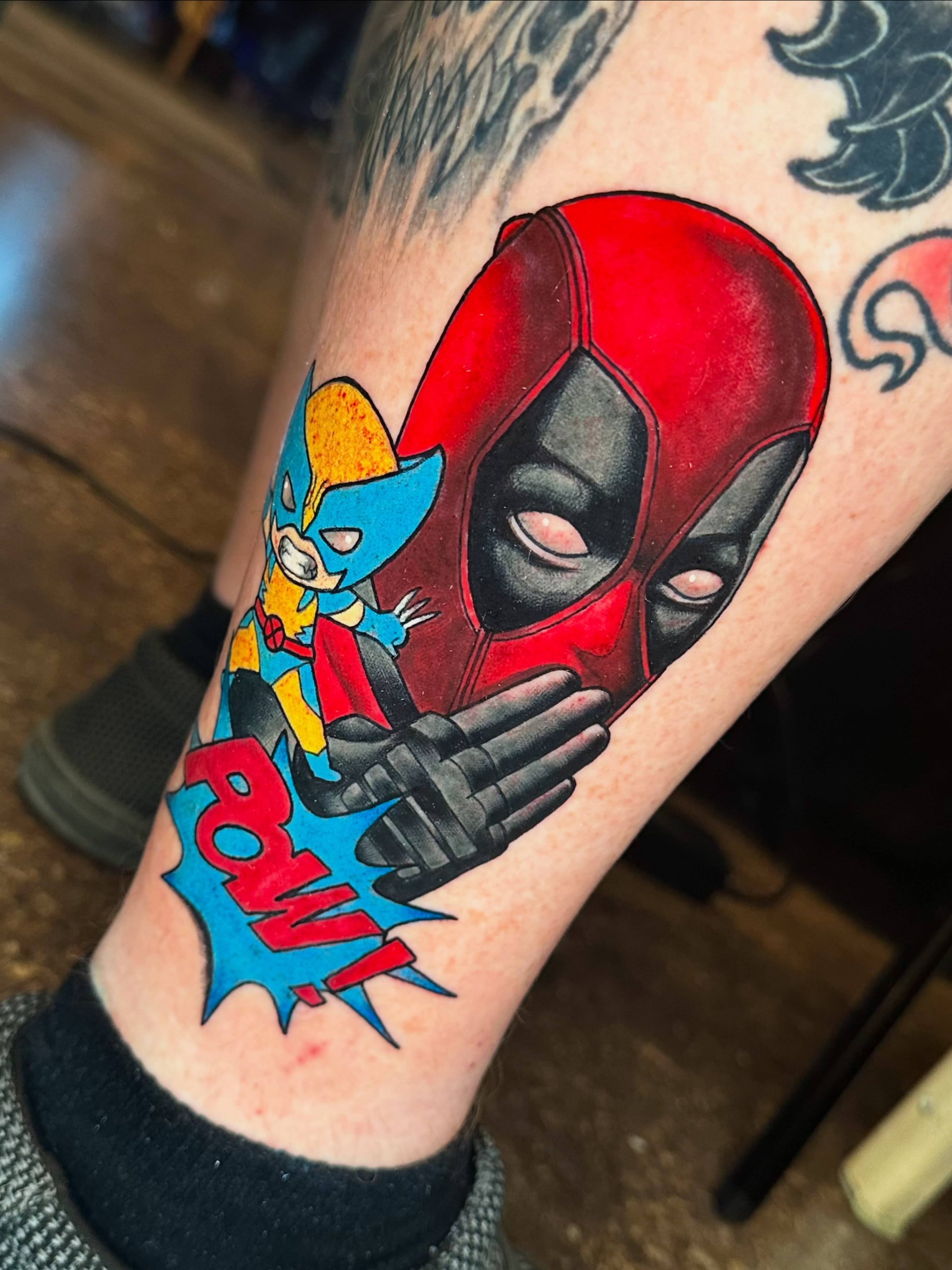 Deadpool and cyclops new school tattoo on the forearm by Lexi Wilkinson