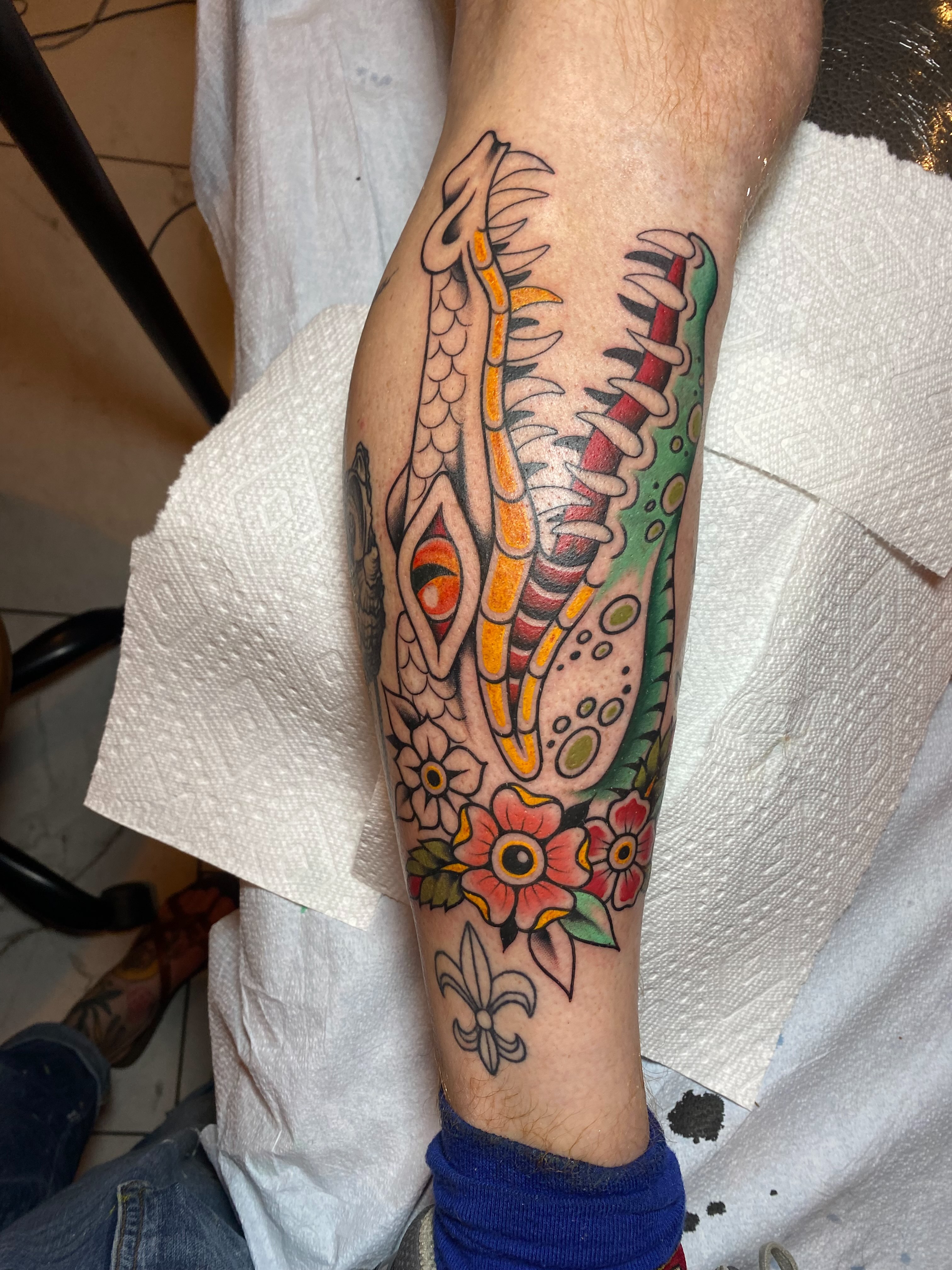 Serpent and floral American traditional tattoo on the forearm by Vivian HavaTattoo, Richmond, Virginia