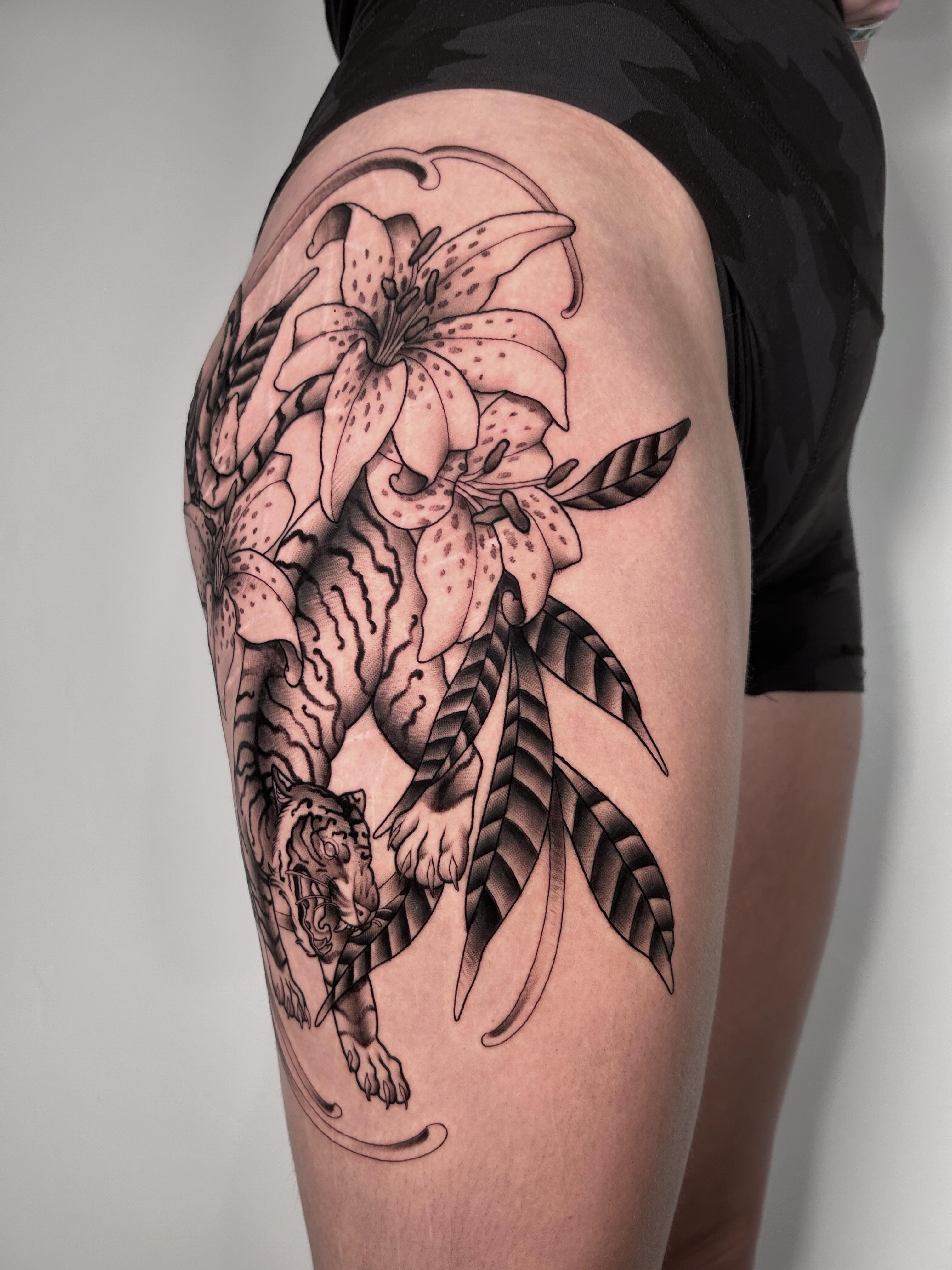 Lily and tiger realism tattoo on the thigh by Salt Lake City tattoo artist