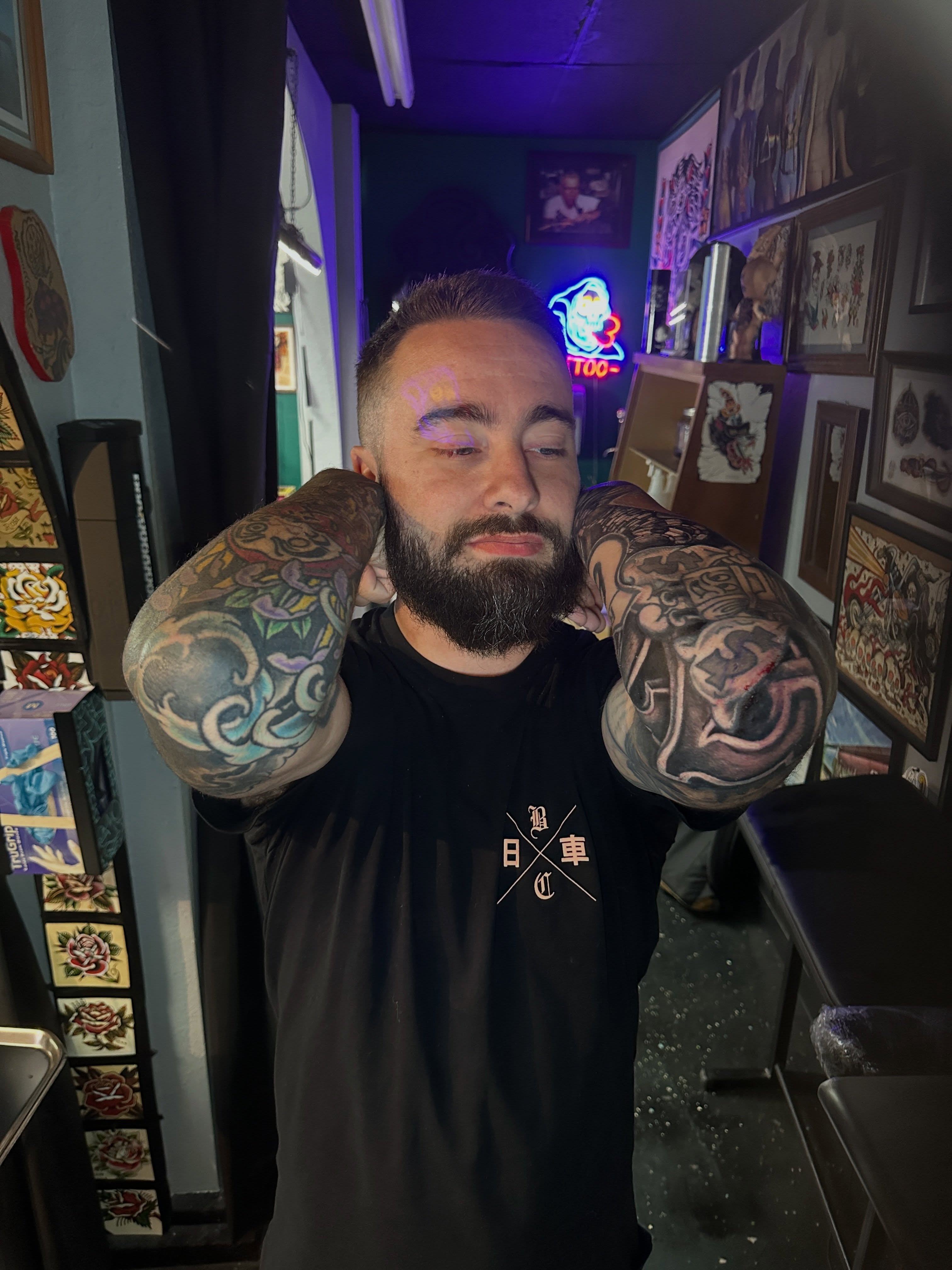 Bearded man American traditional tattoo on the upper arm by Matthew Tattooer Harman