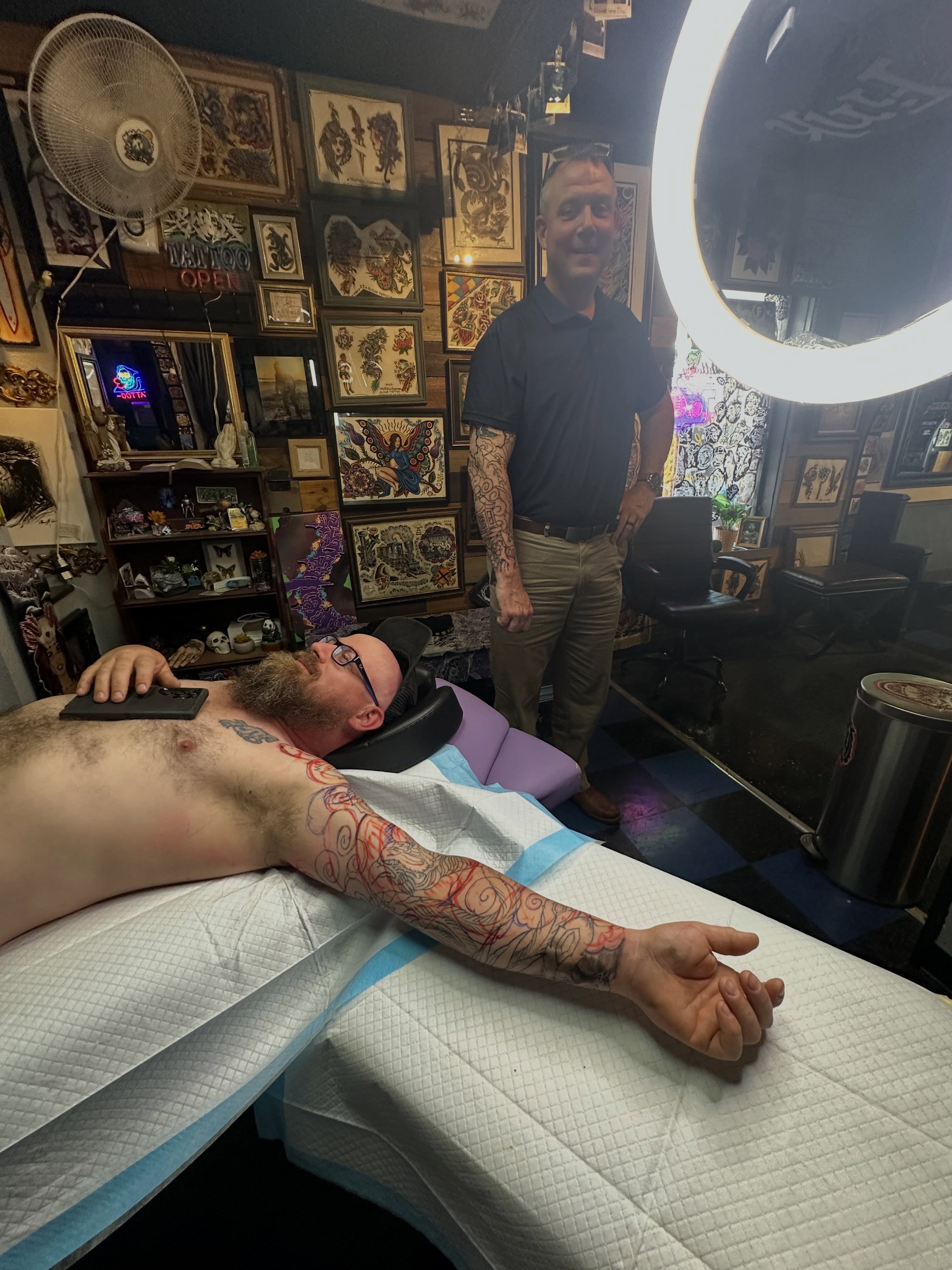 Abstract design new school tattoo on the upper arm by Matthew Tattooer Harman