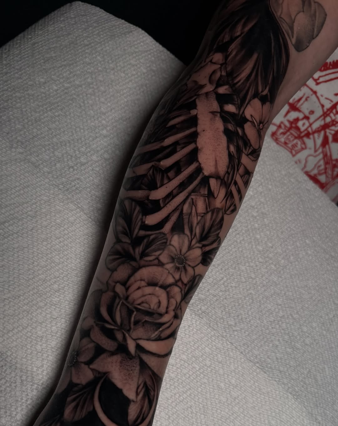 Floral and ribcage realism tattoo on the forearm by ๐ฎ๐๐๐ฐ ๐๐ซ๐ค๐ข๐ฉ๐ฌ ๐๐๐ฆ๐๐ซ๐ฬ