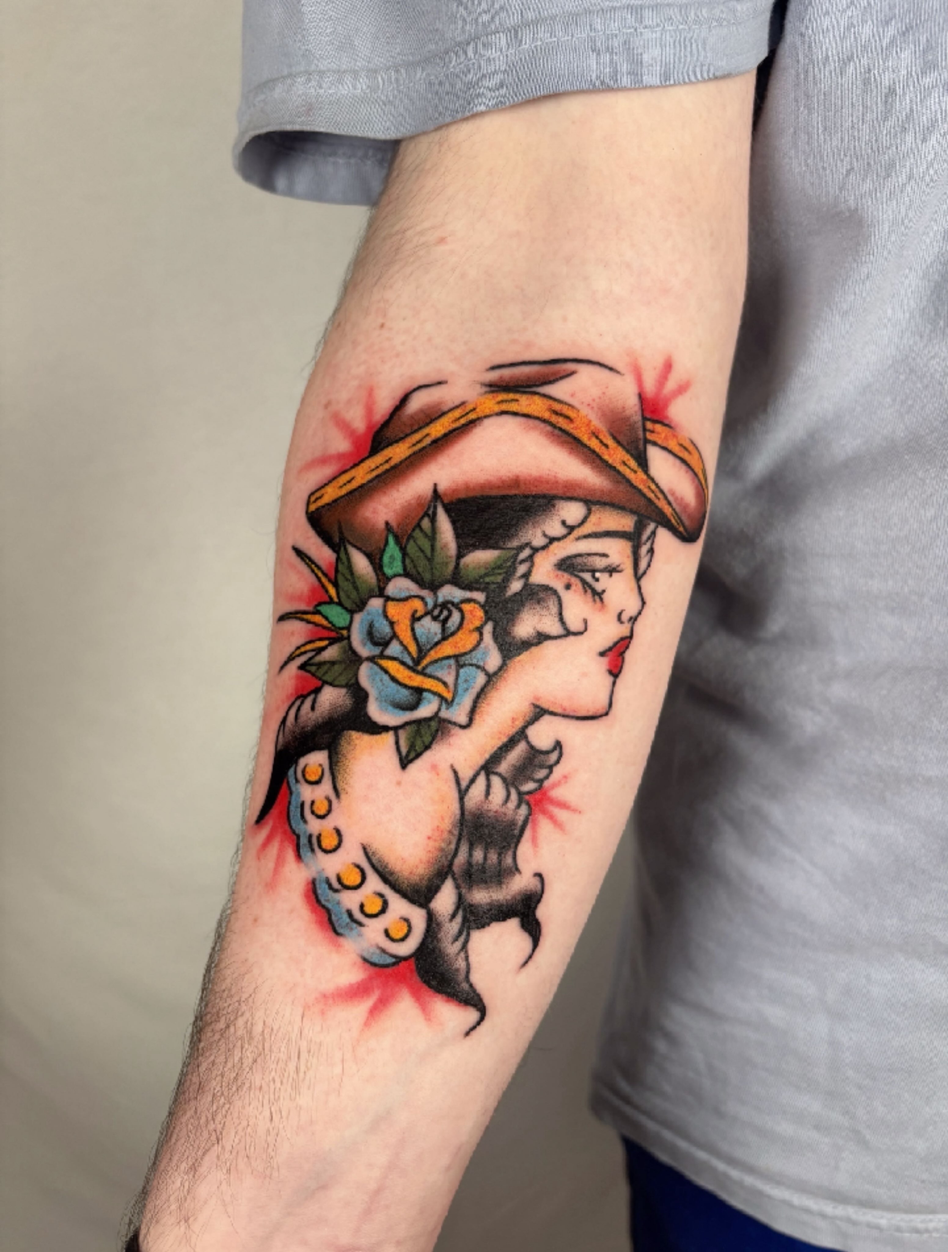 Woman with hat American traditional tattoo on the forearm by Davie Tattoos