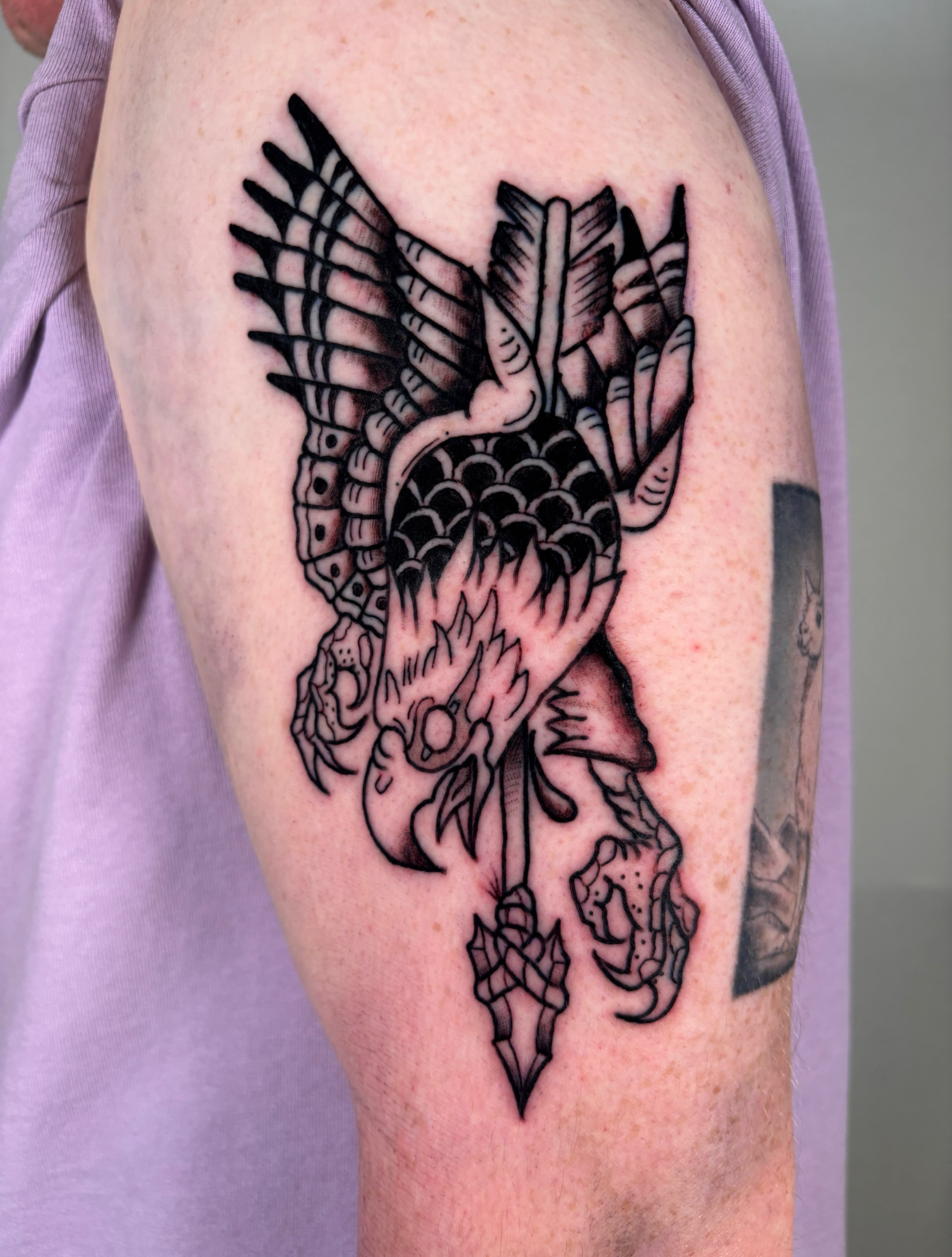 Phoenix black and grey tattoo on the forearm by Davie Tattoos