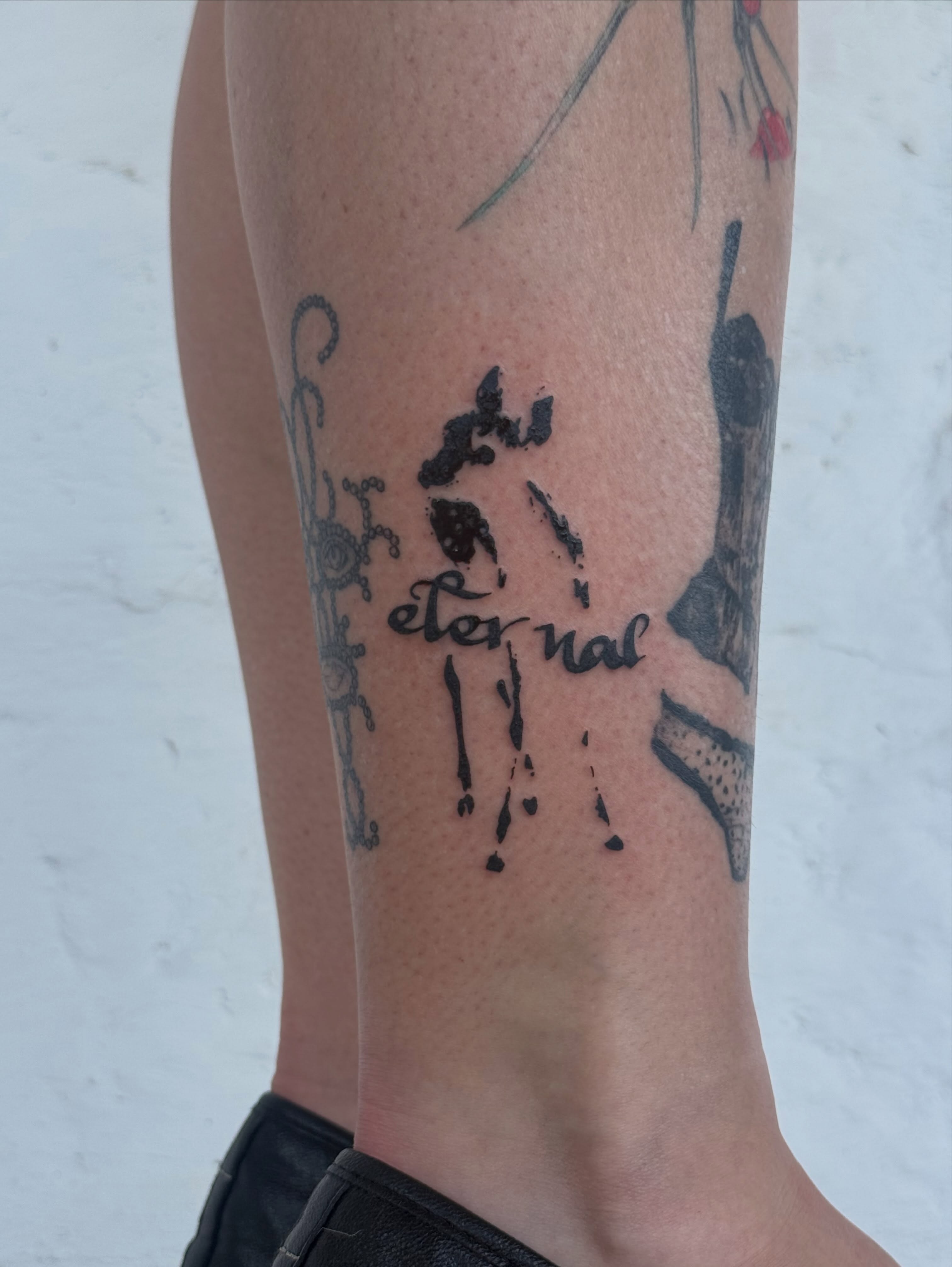 Footprint with text dotwork tattoo on the calf by sarah