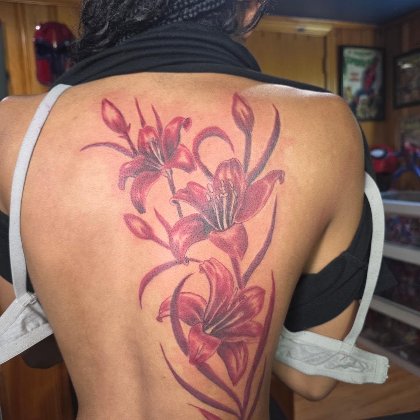 Lilies realism tattoo on the back by Rusty Williams