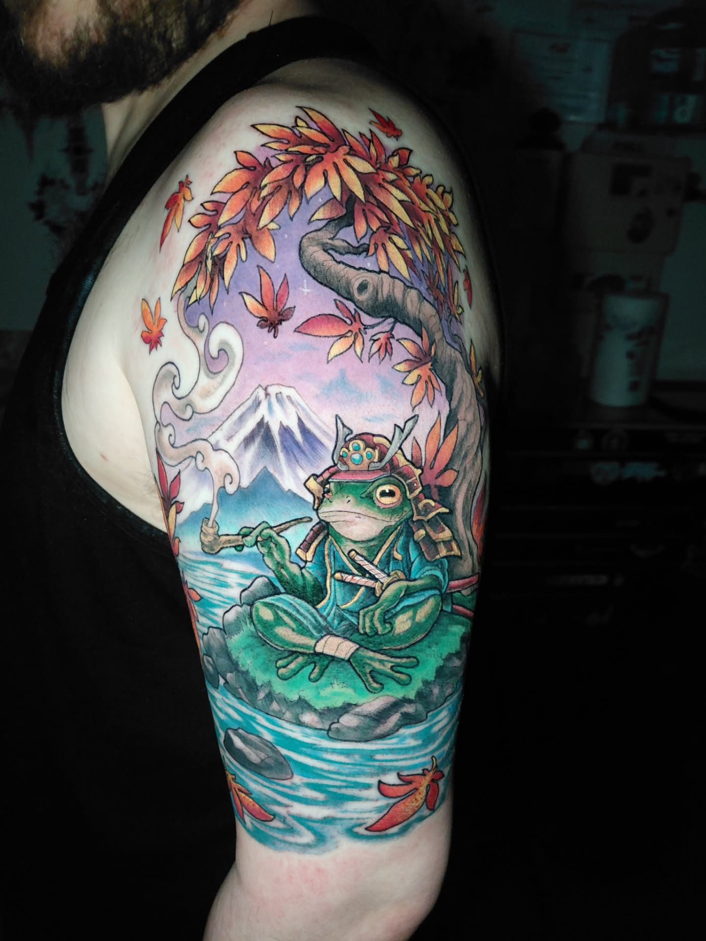 Frog samurai illustrative tattoo on the upper arm by Chris Bowen