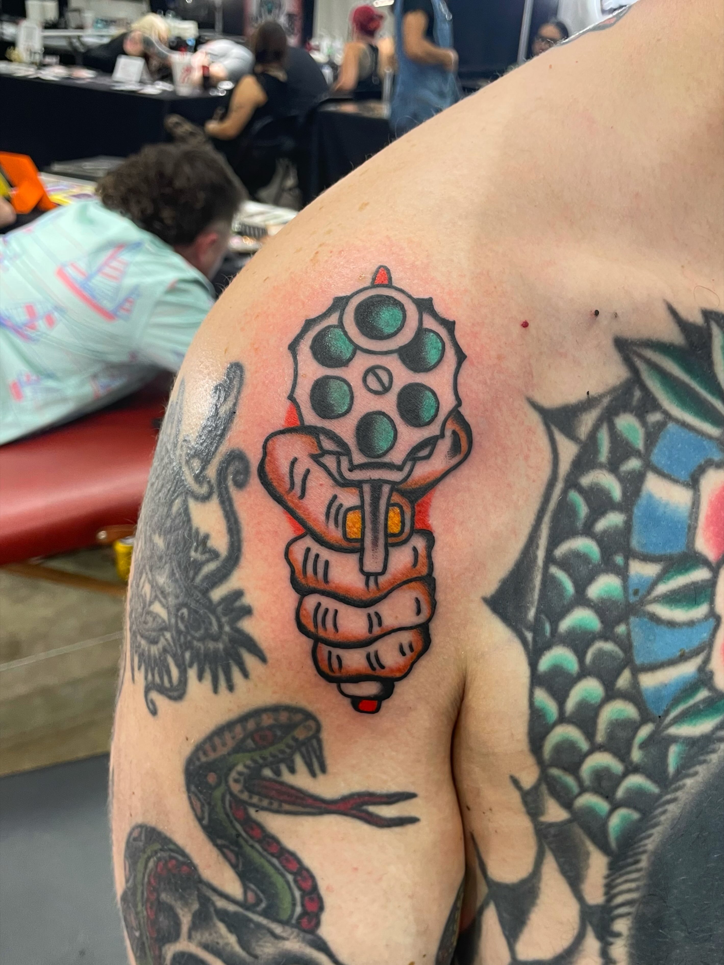 Gun American traditional tattoo on the shoulder by nancy❣️