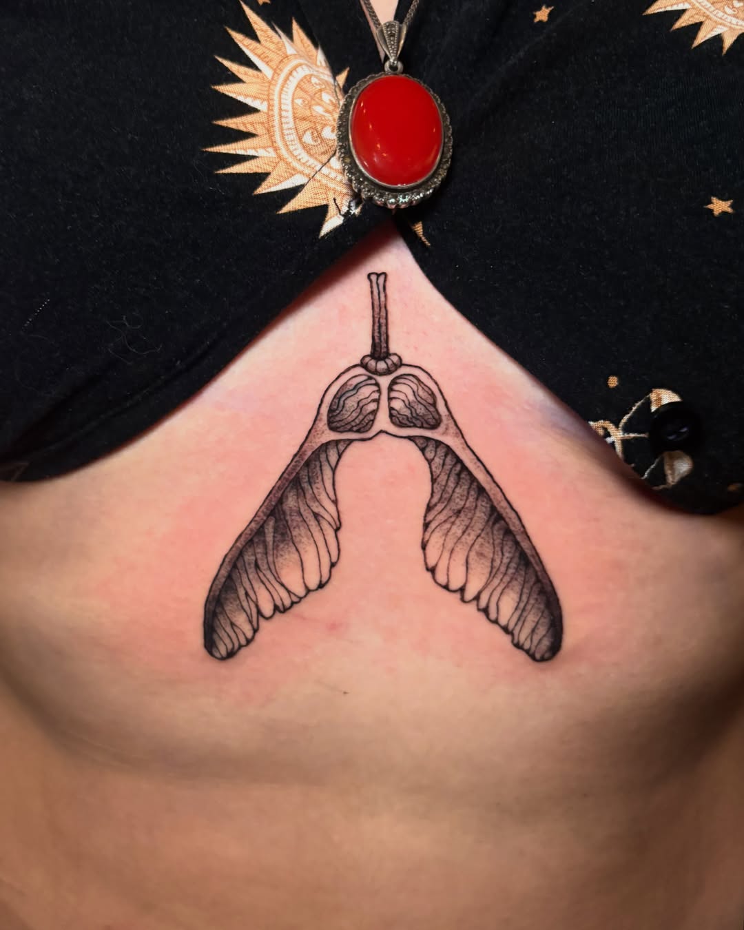 Lungs with wings black and grey tattoo on the chest by Abby Ruok, Midvale, Utah