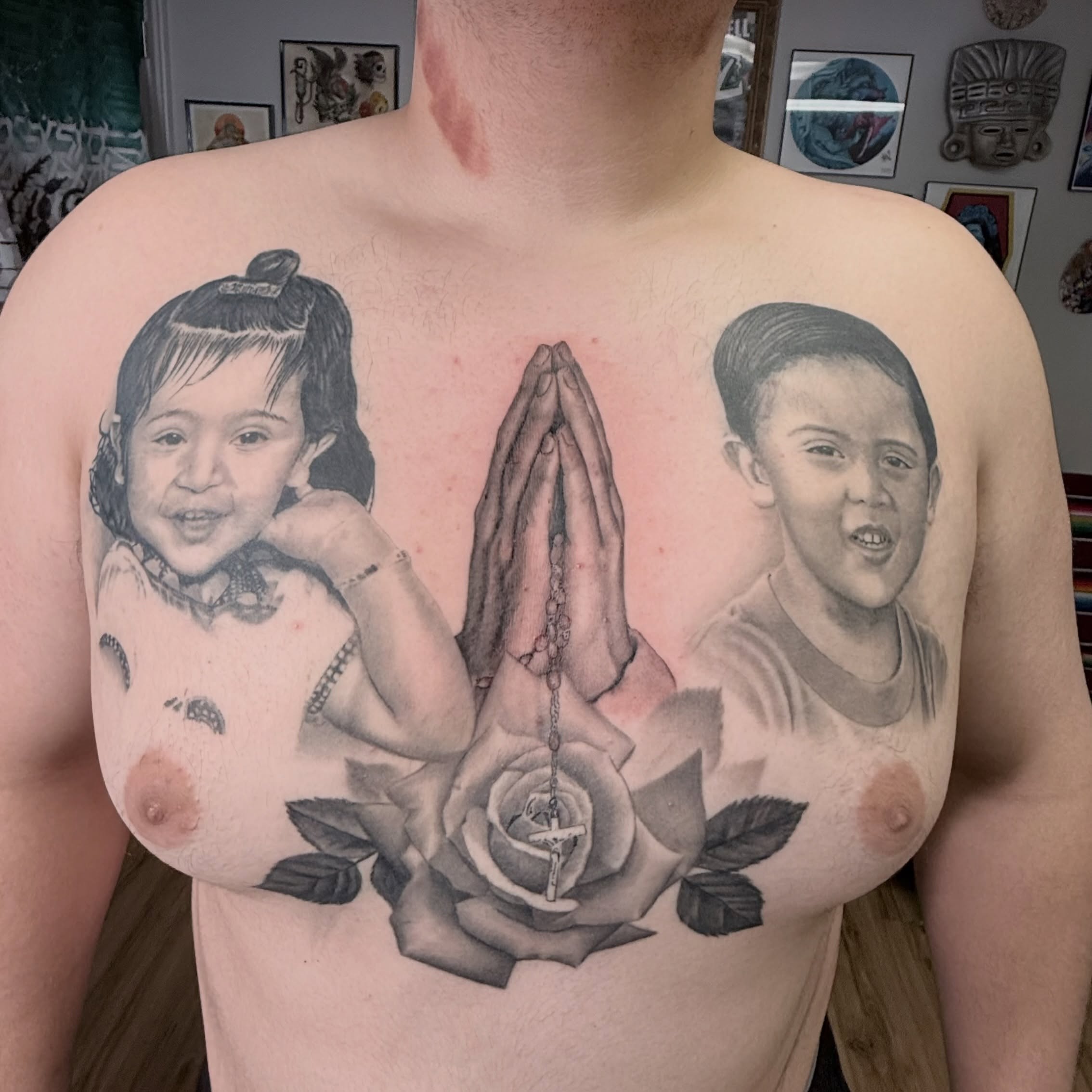 Prayer hands and children realism tattoo on the chest by Gilberto Flores Nava