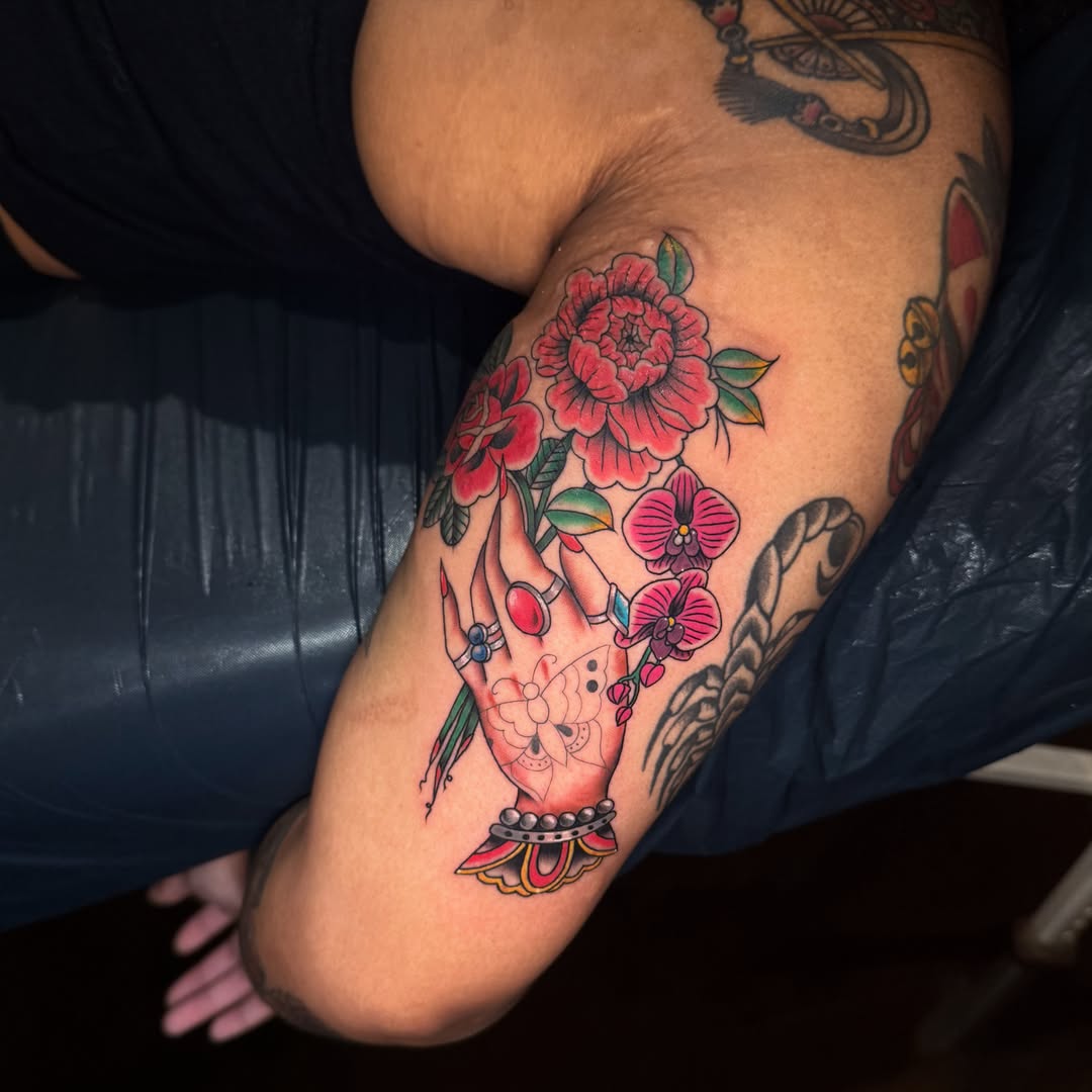 Floral bouquet American traditional tattoo on the forearm by Amanda