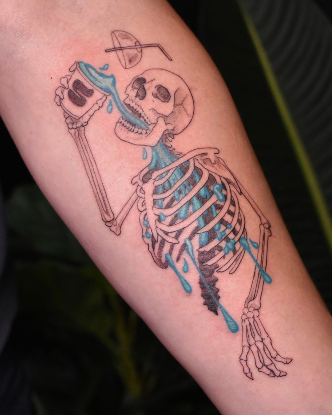 Skeleton drinking dotwork tattoo on the forearm by Erin Isaacs