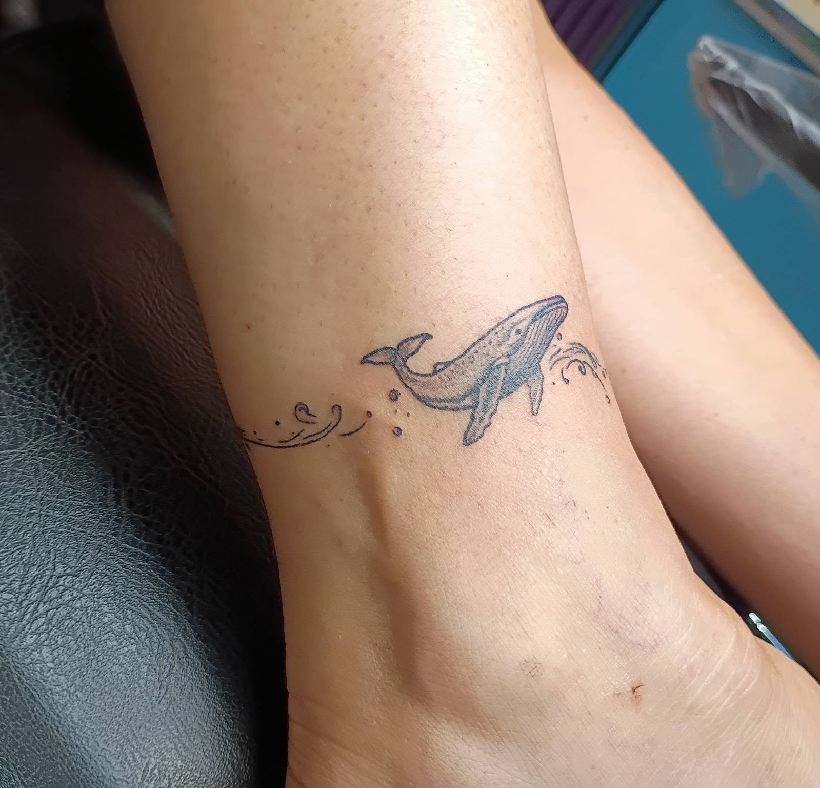 Whale black and grey tattoo on the forearm by Tiffany