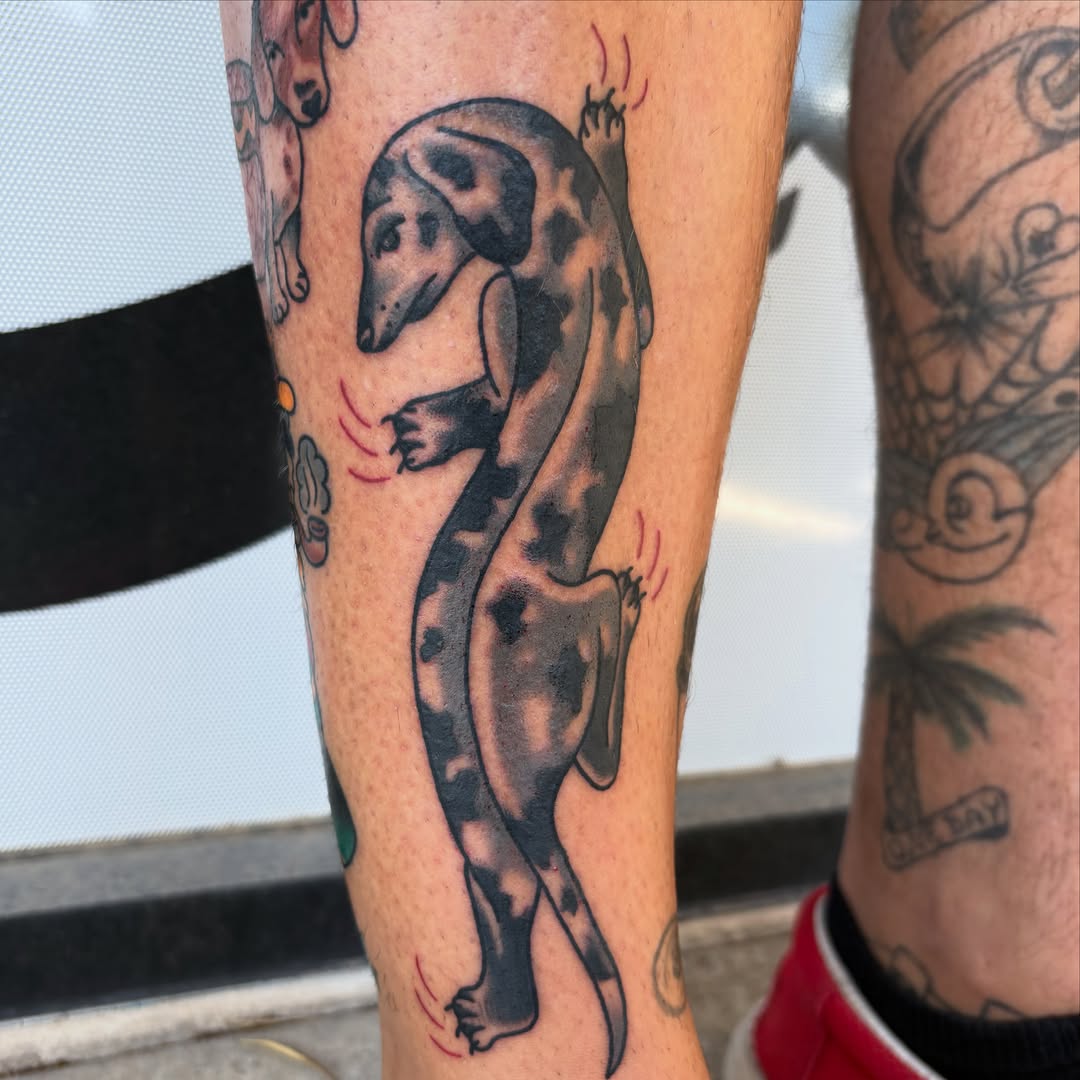 Dinosaur black and grey tattoo on the forearm by Allyson Monique