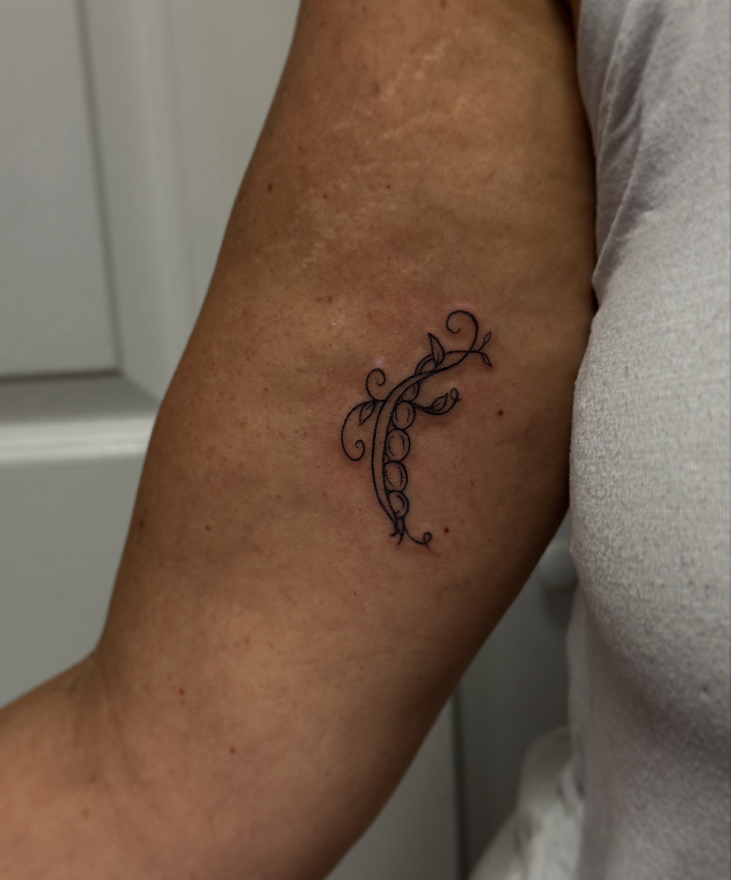 Letter 'F' ornamental tattoo on the forearm by Jocelyn