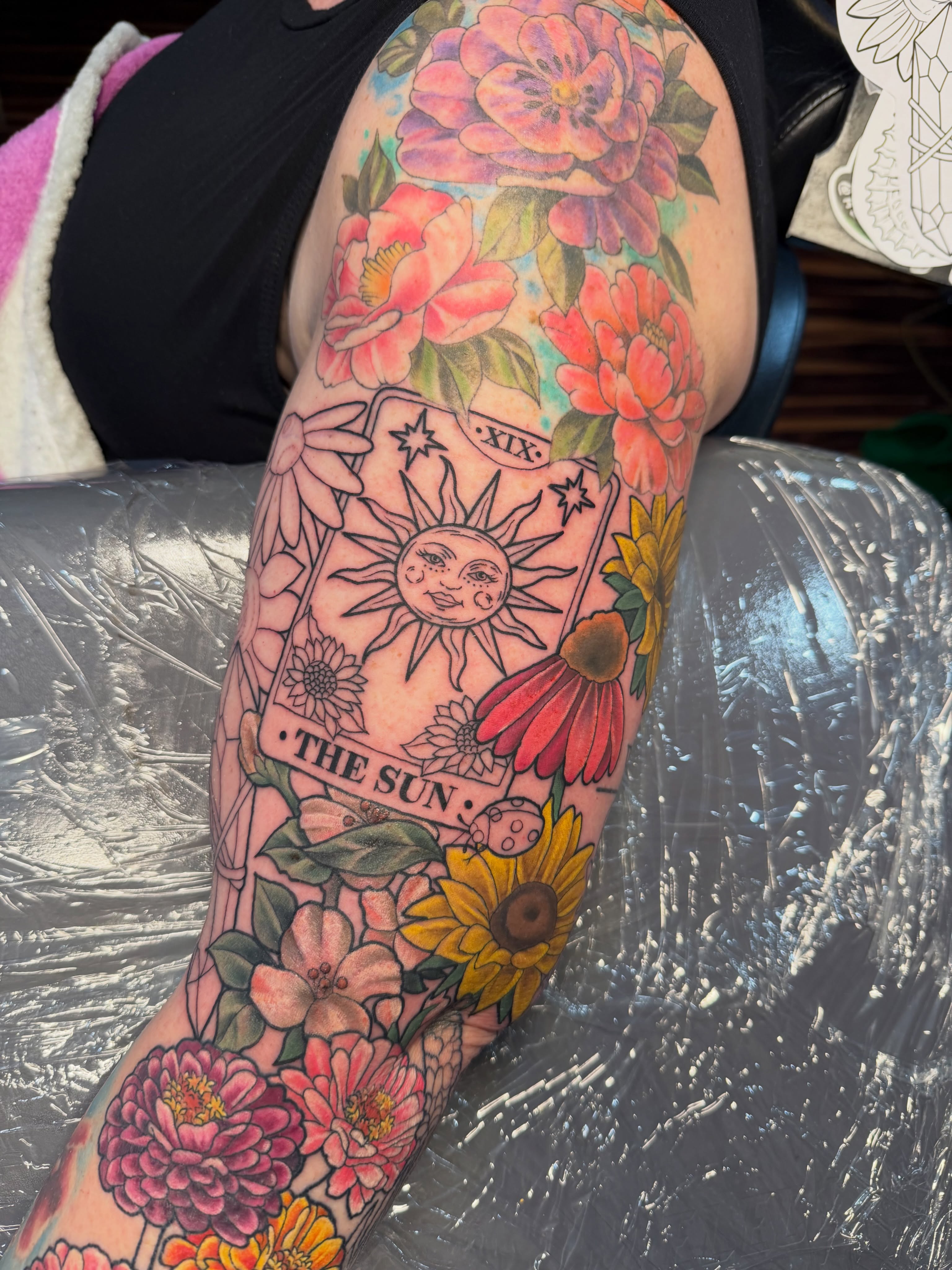 The sun tarot card new school tattoo on the forearm by TyAnne Schulte