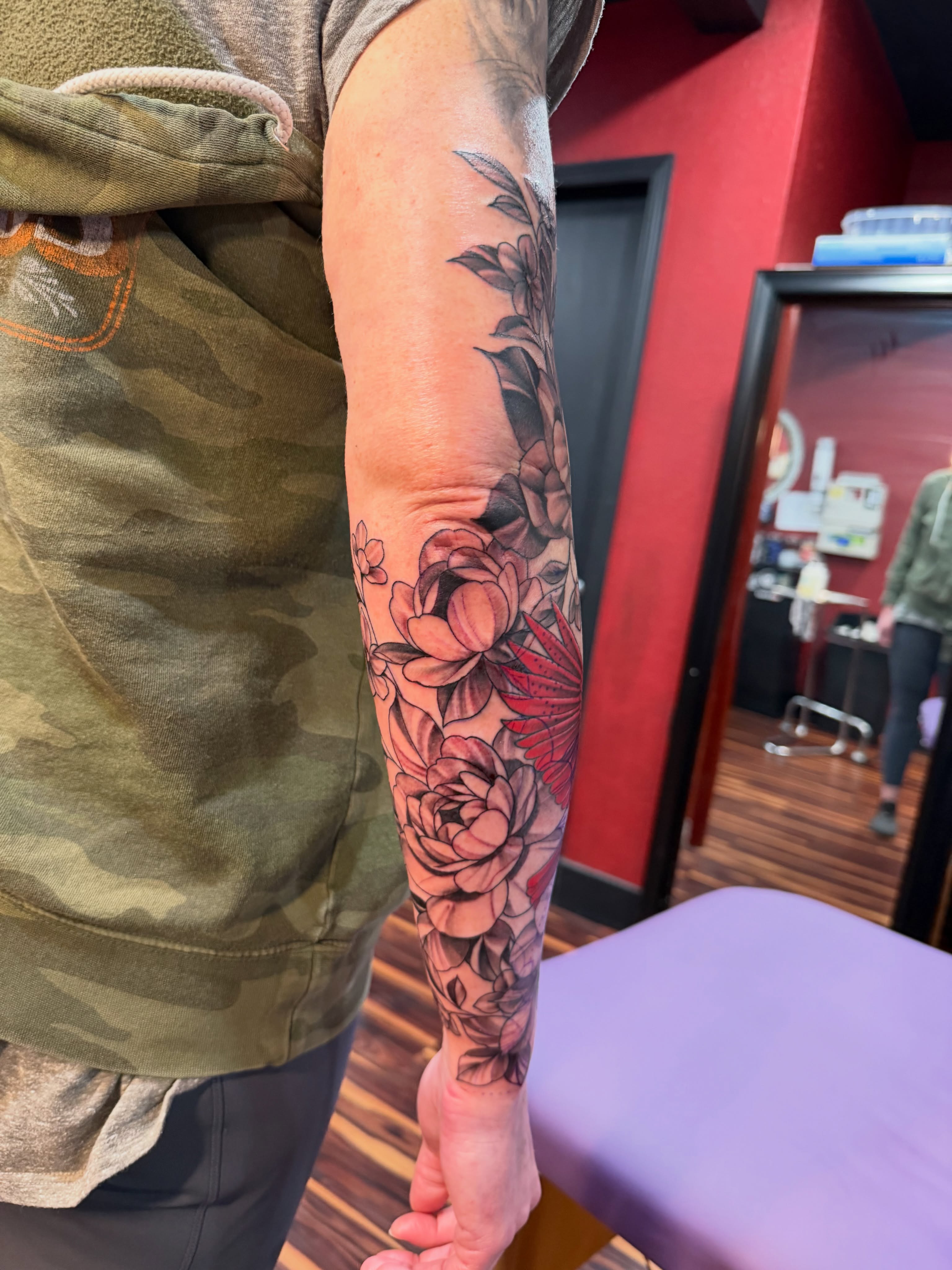 Floral bouquet realism tattoo on the forearm by TyAnne Schulte