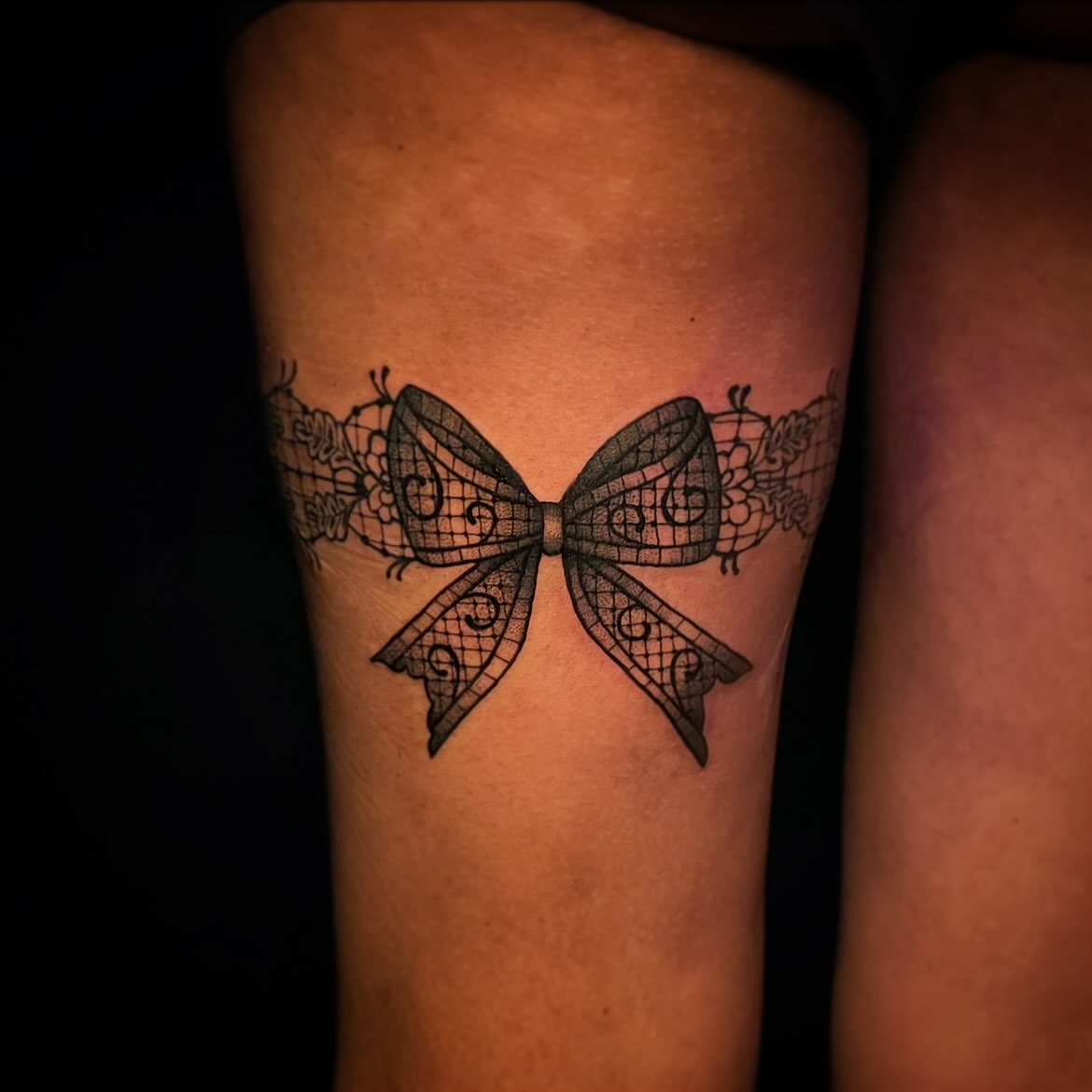 Lacy bow black and grey tattoo on the forearm by 𝕲𝖗𝖆𝖈𝖊 🥀 ᴛᴀᴛᴛᴏᴏ