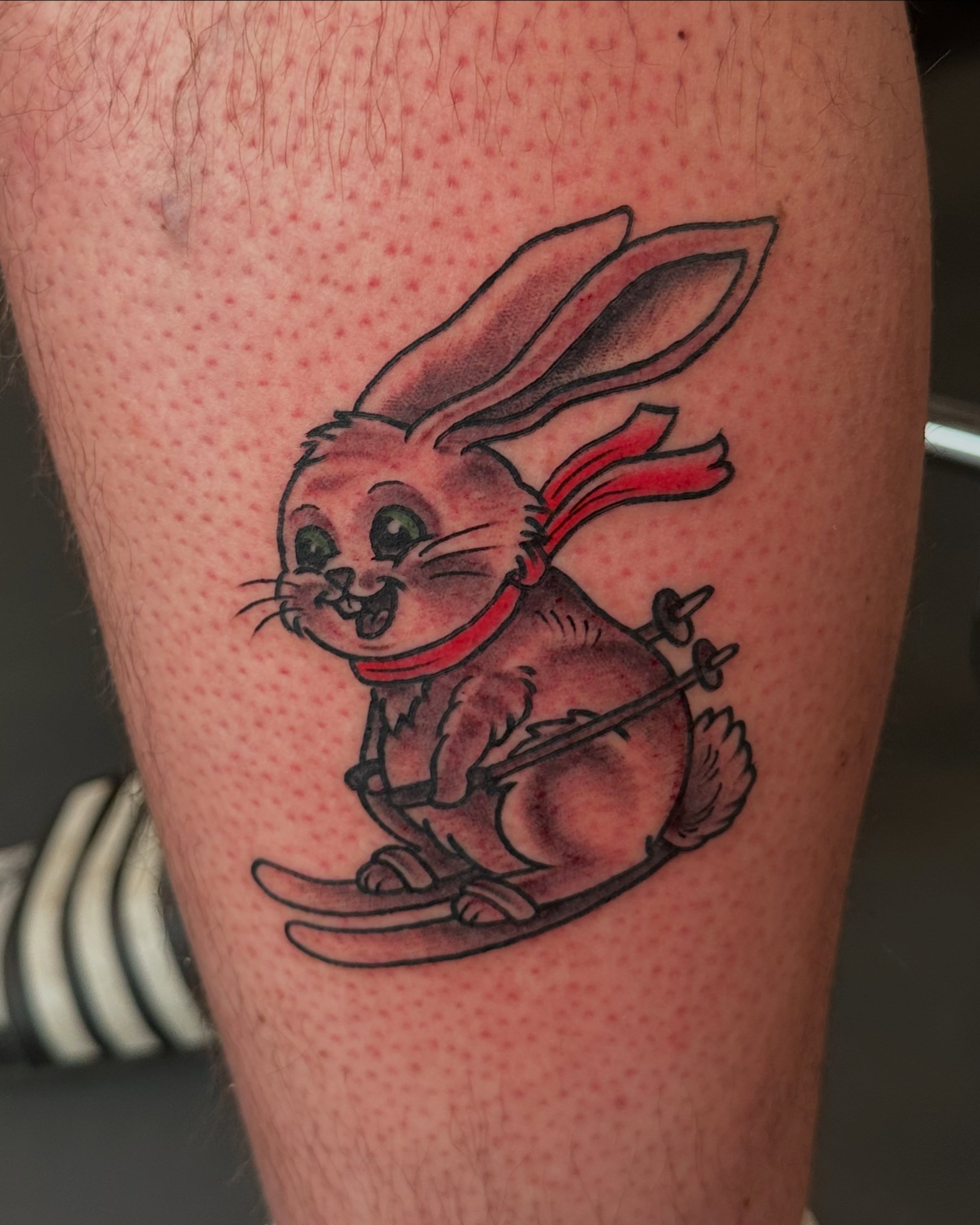 Rabbit skiing realism tattoo on the thigh by Nick Bones, Las Vegas, Nevada