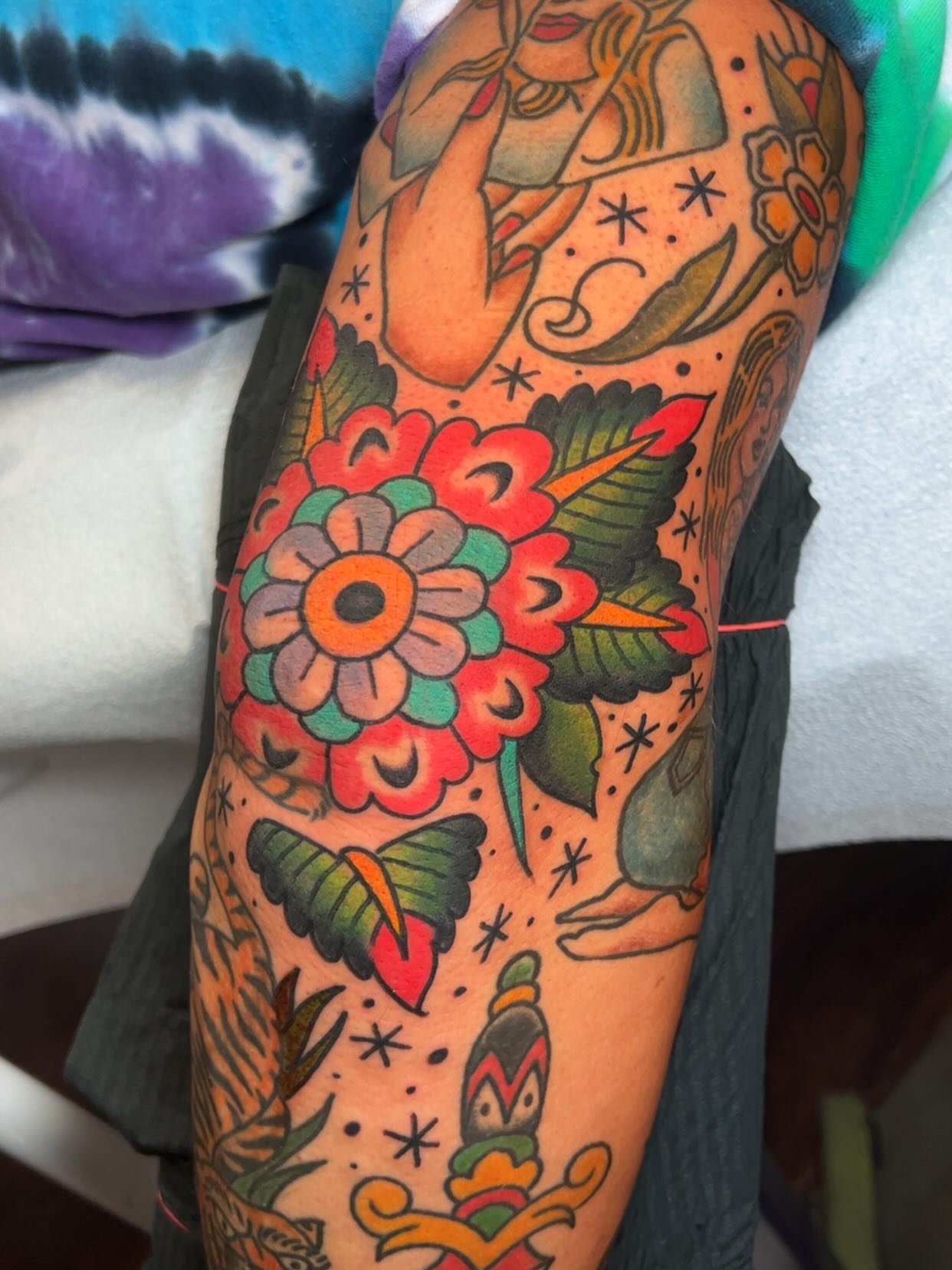 Floral bouquet American traditional tattoo on the thigh by Mat Helton, Fairborn, Ohio
