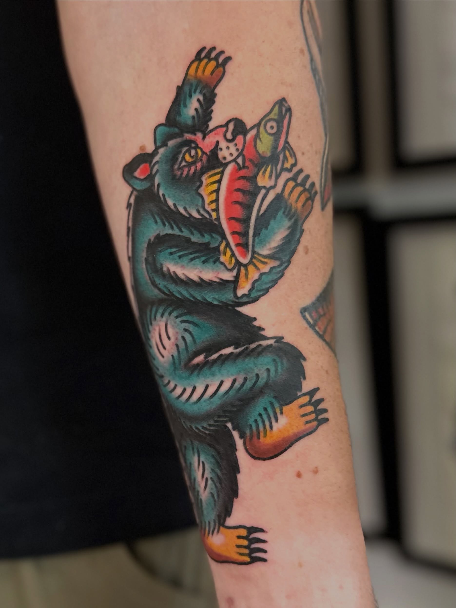 Bear catching fish American traditional tattoo on the forearm by Nick Weaver aka gibby sometimes gilbert