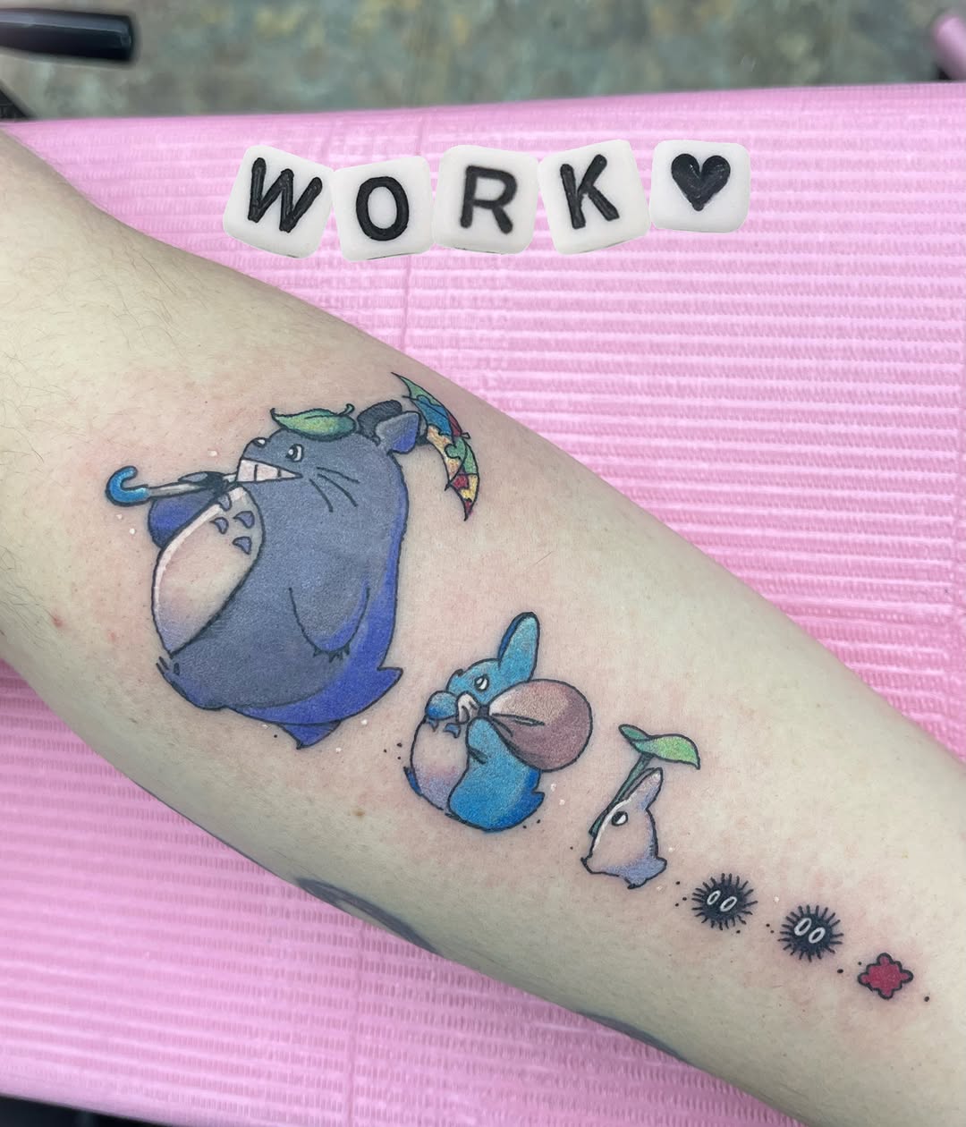 Totoro family watercolor tattoo on the forearm by Cami Rose