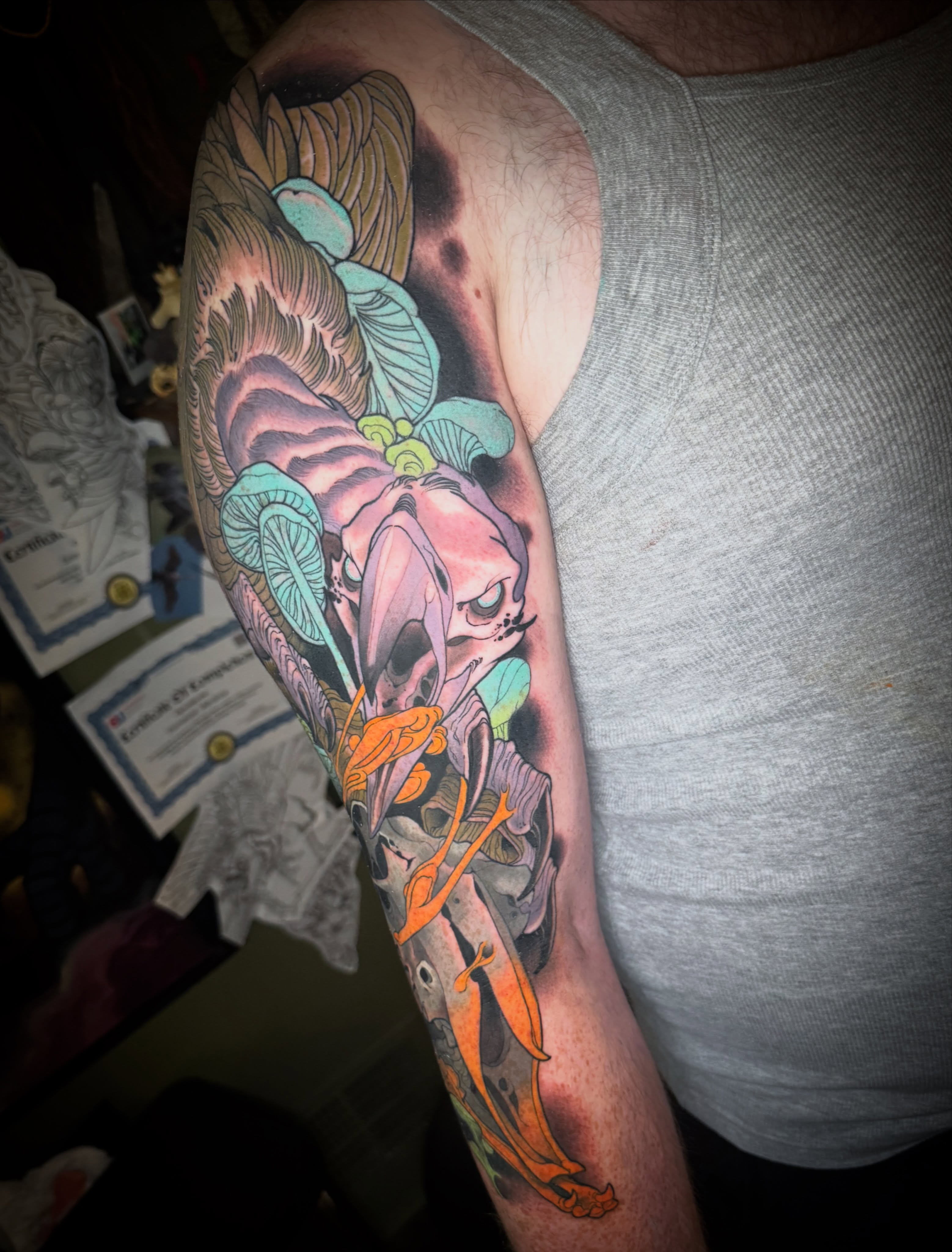 Skull and flowers American traditional tattoo on the forearm by Emmanuel Mendoza
