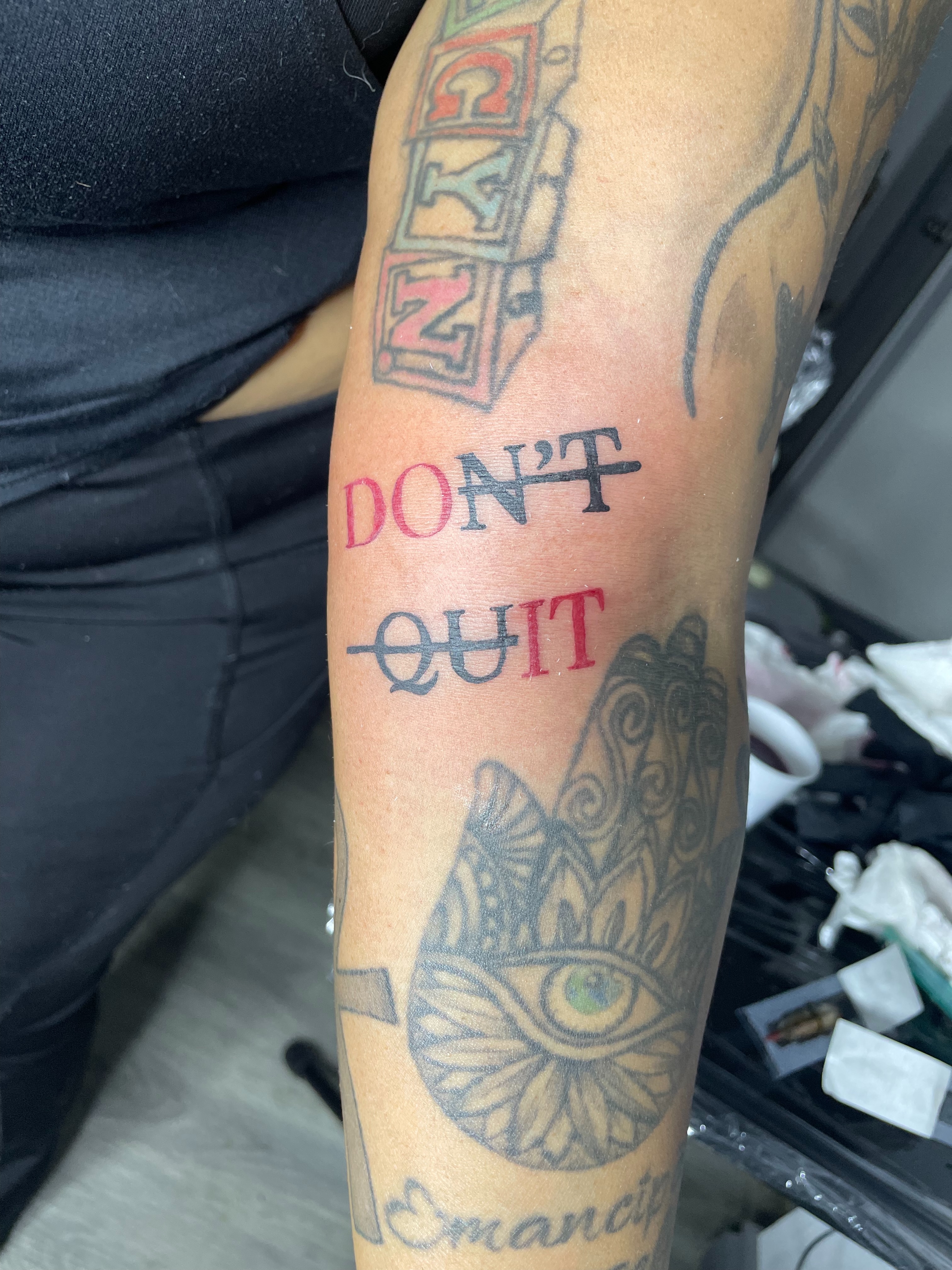 Motivational phrase lettering script tattoo on the forearm by 😈headhuncho😈