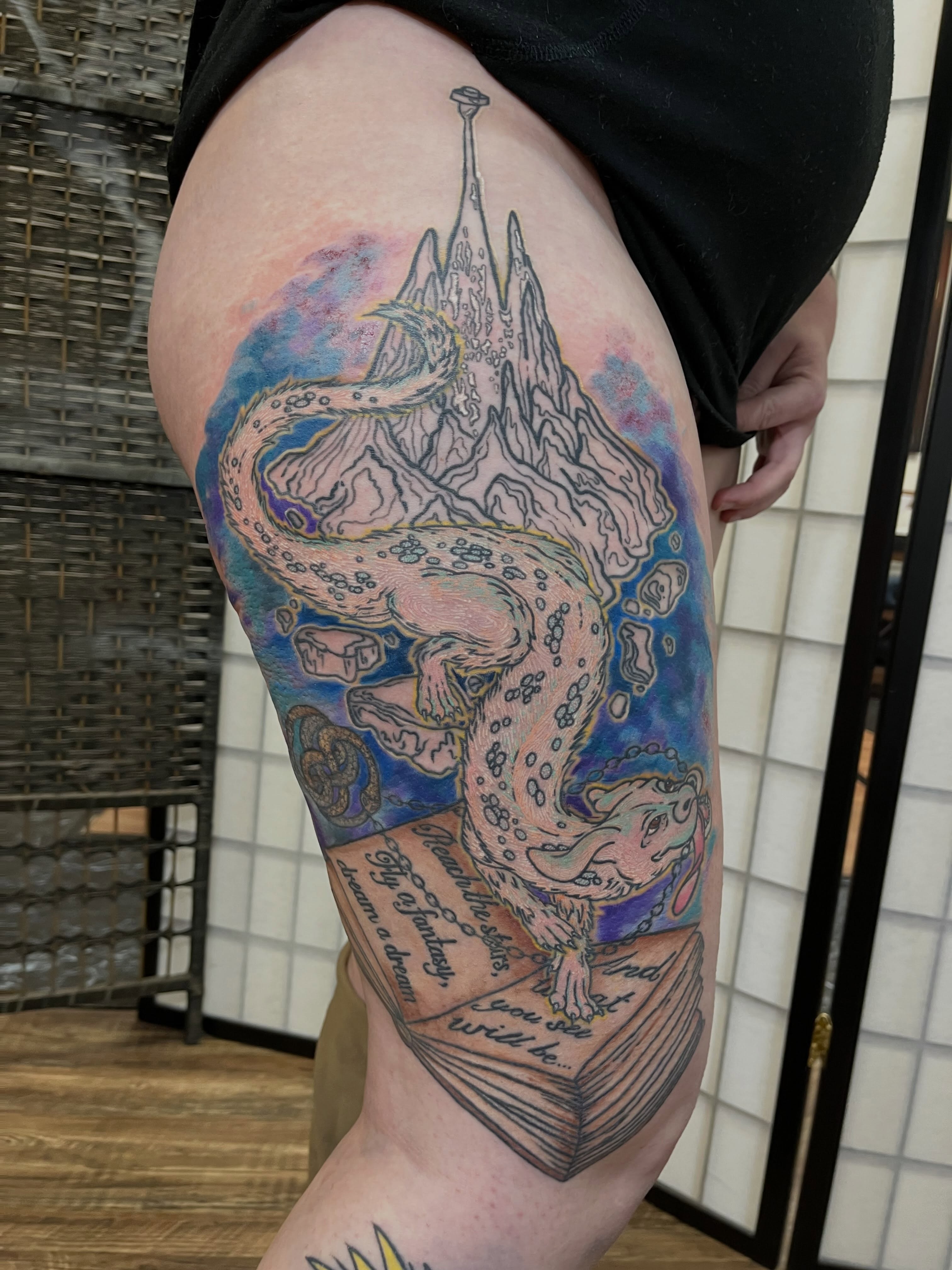 Serpent and mountain dotwork tattoo on the thigh by Lauryn Dunkle
