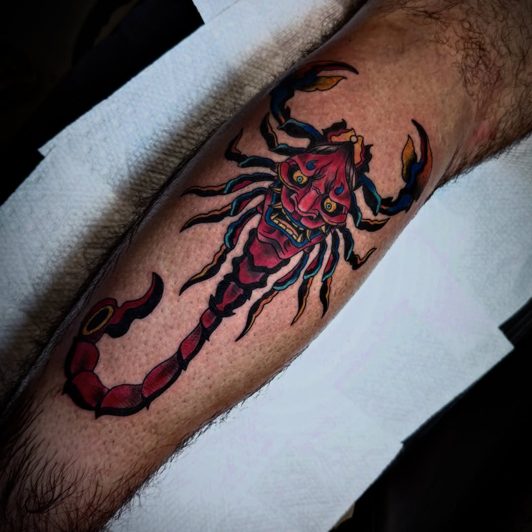 Demon mask American traditional tattoo on the forearm by Randi Frey