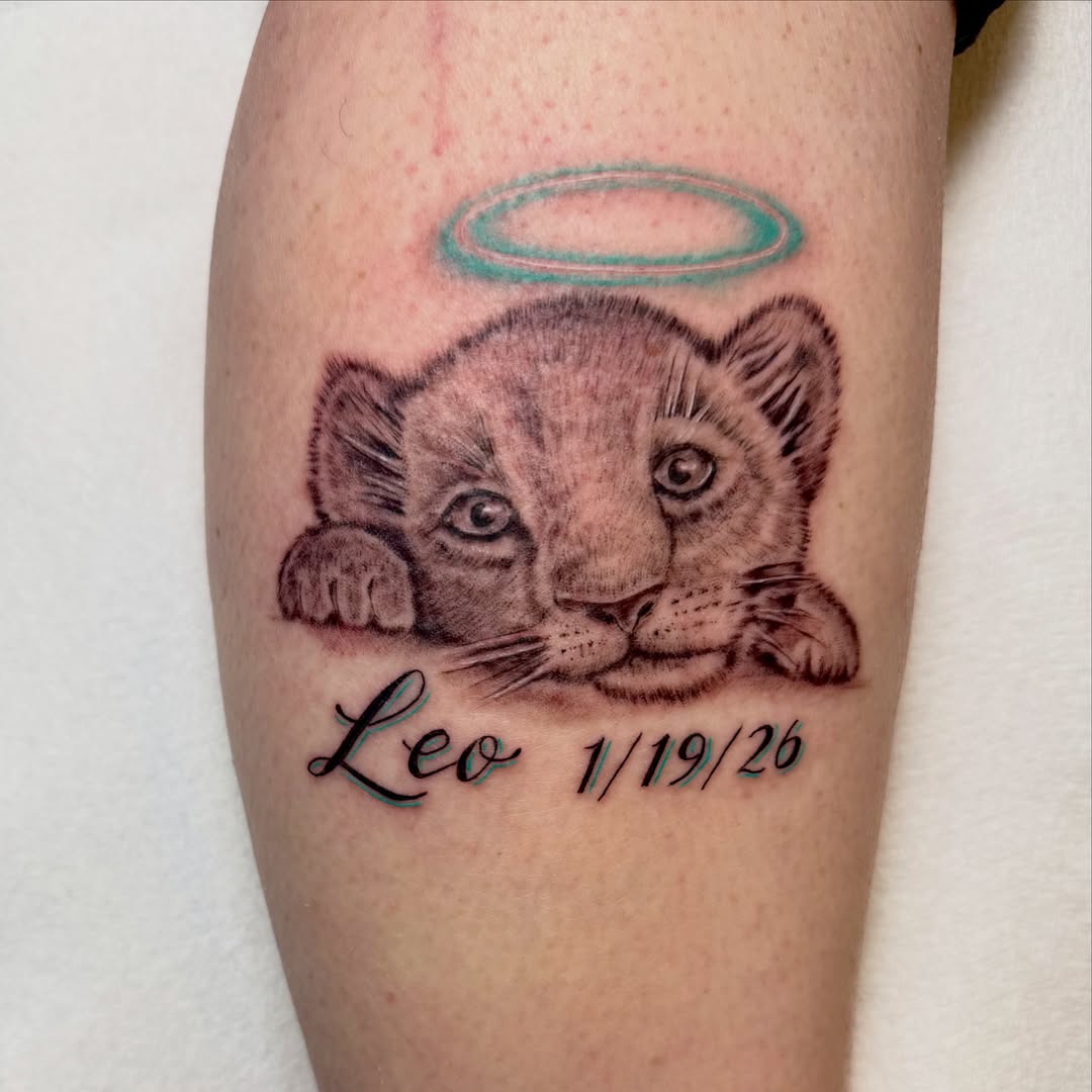 Lion cub realism tattoo on the forearm by Jerry Thomas