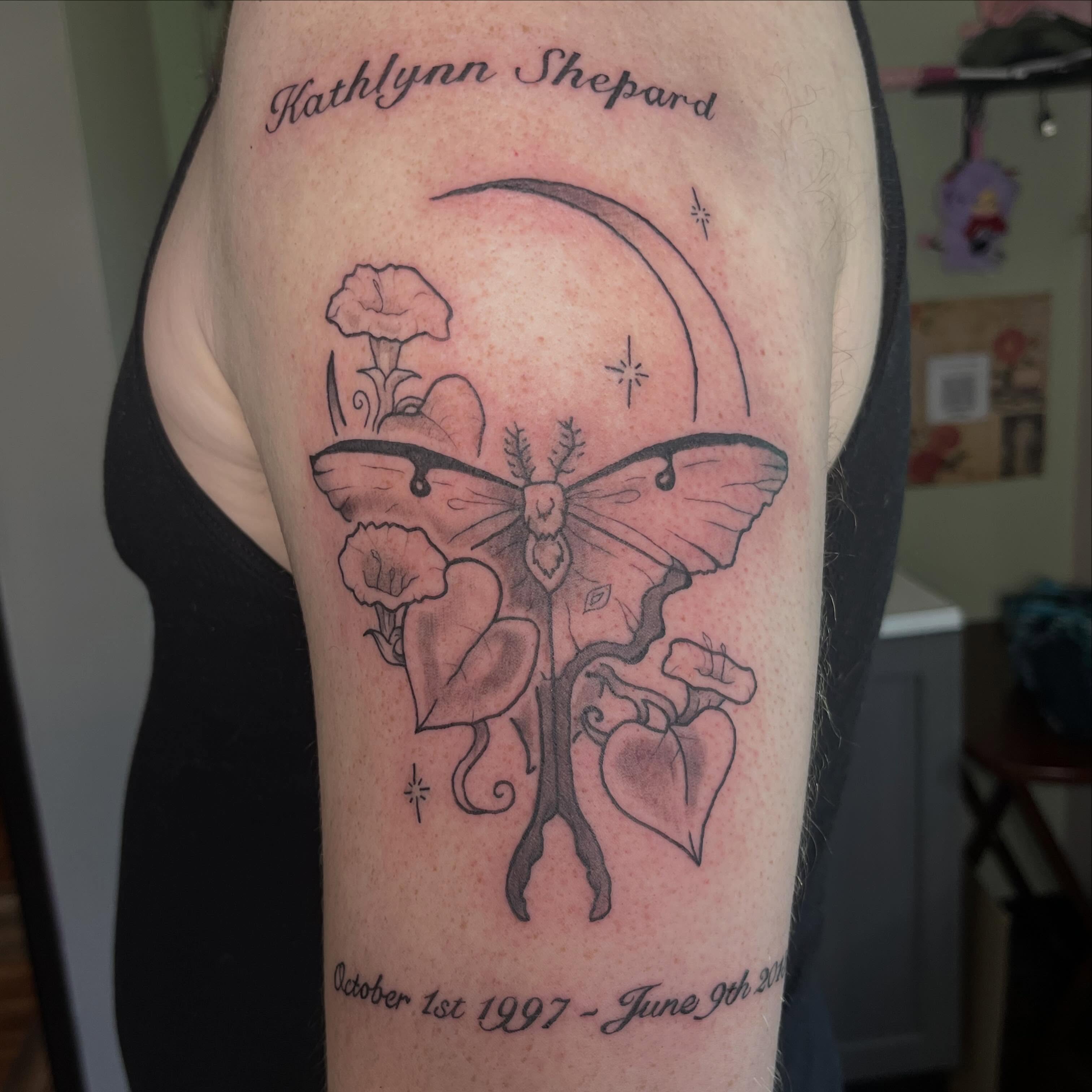 Butterfly and flowers black and grey tattoo on the forearm by Jazzy