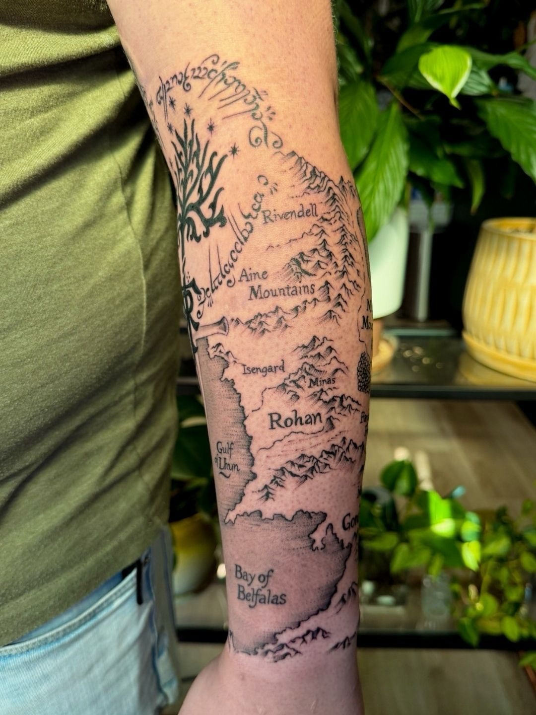 Middle-earth map black and grey tattoo on the forearm by Sarah Margaret